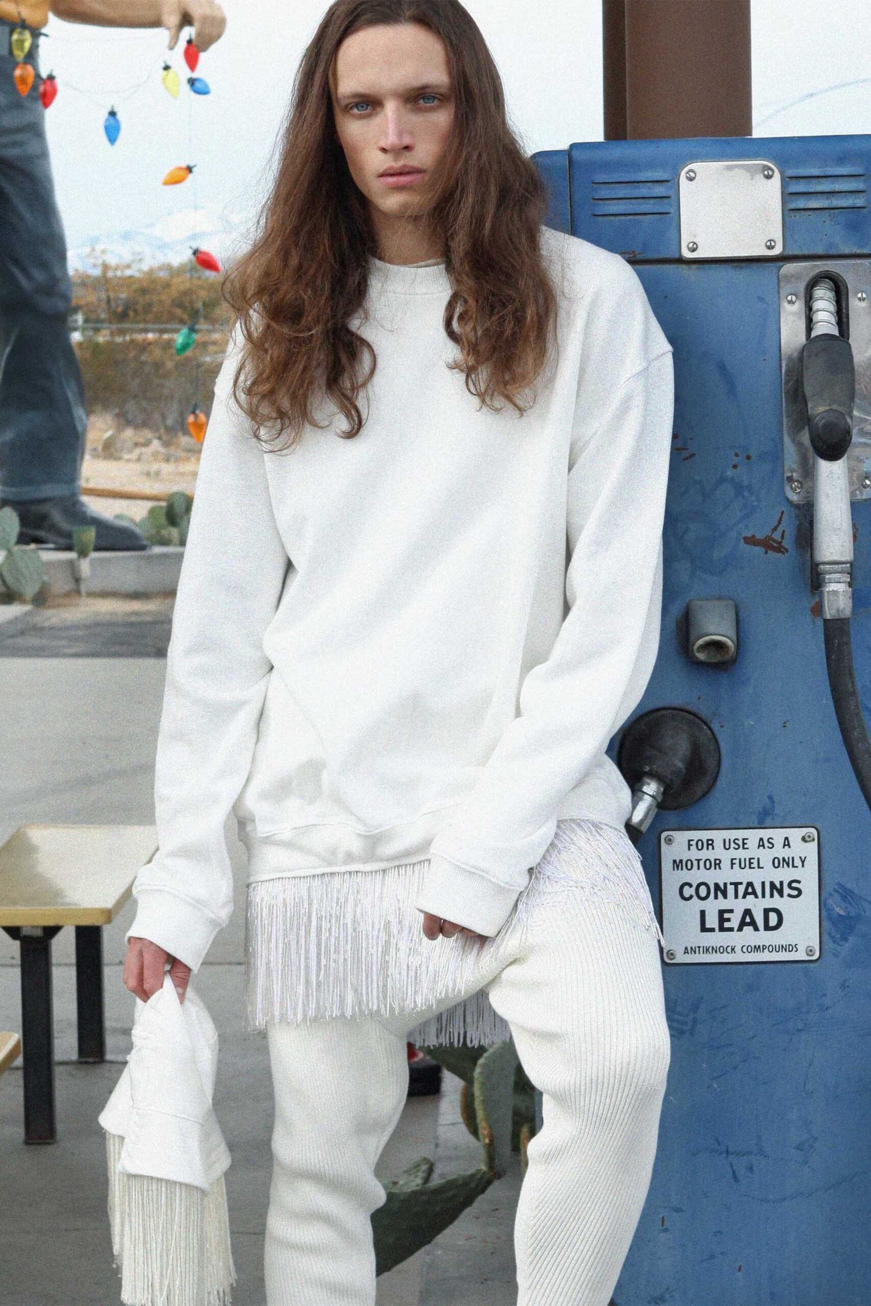 white relaxed sweater with fringe