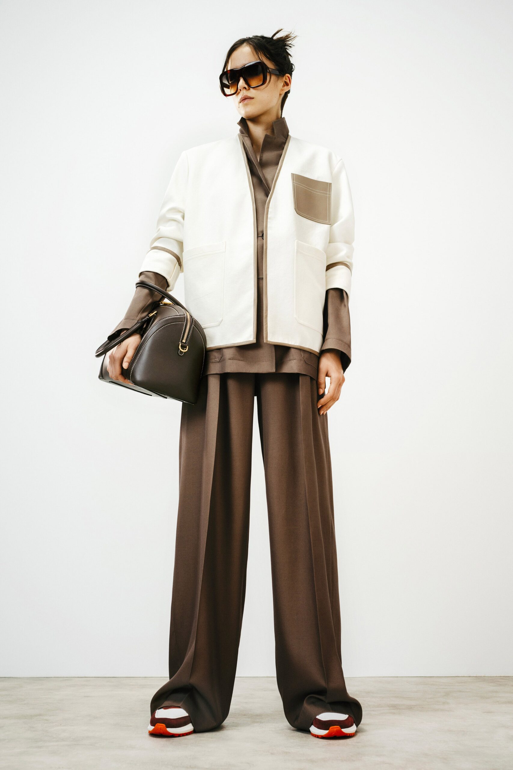 white jacket and brown pants