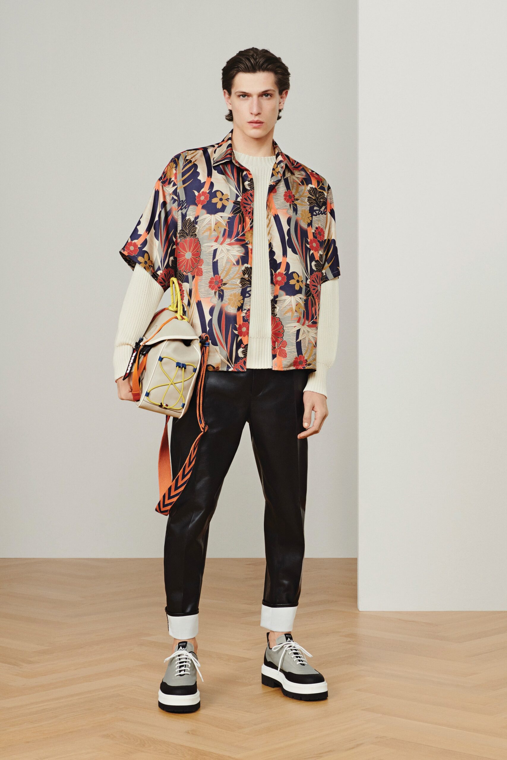 multi-colored floral shirt with leather pants