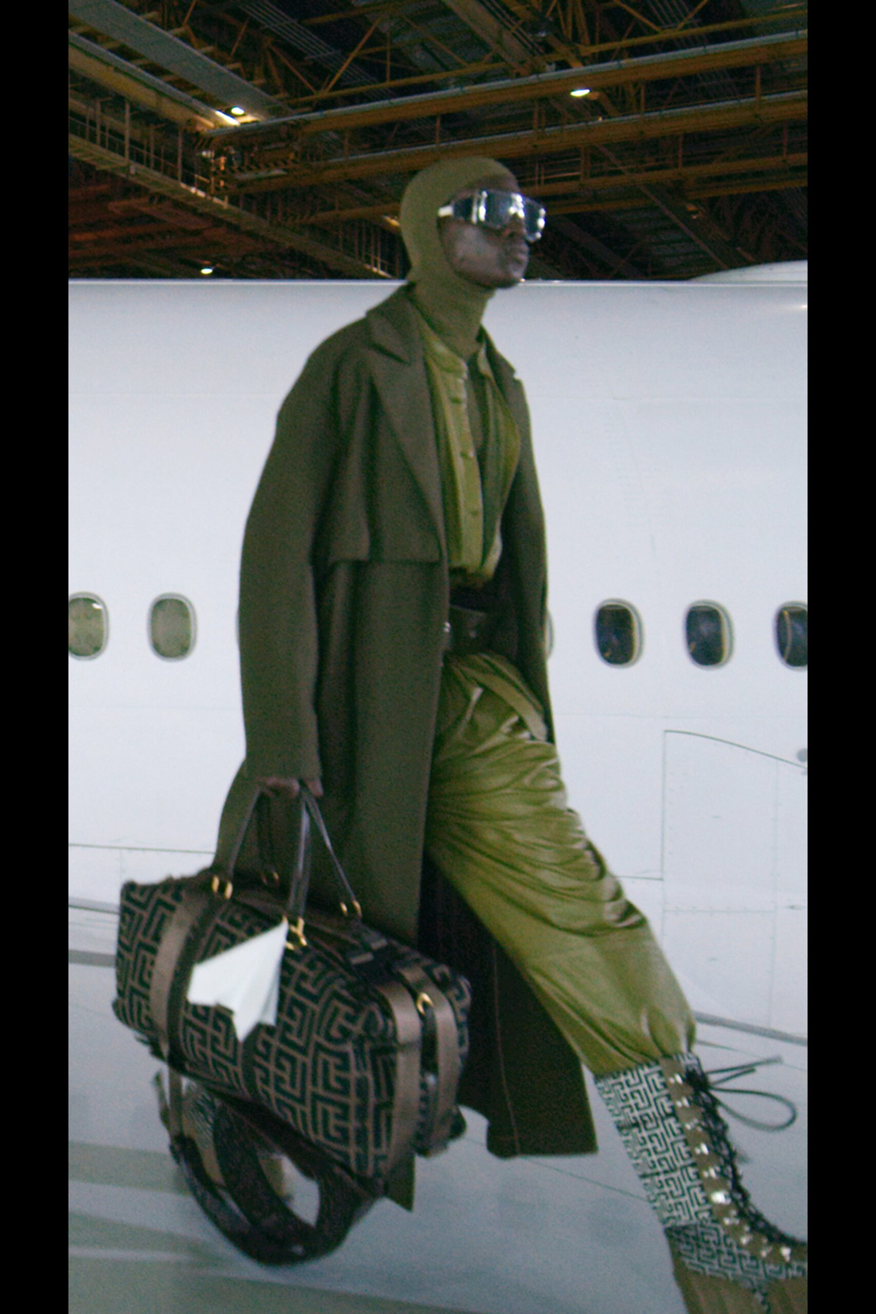 green wool coat with leather pants