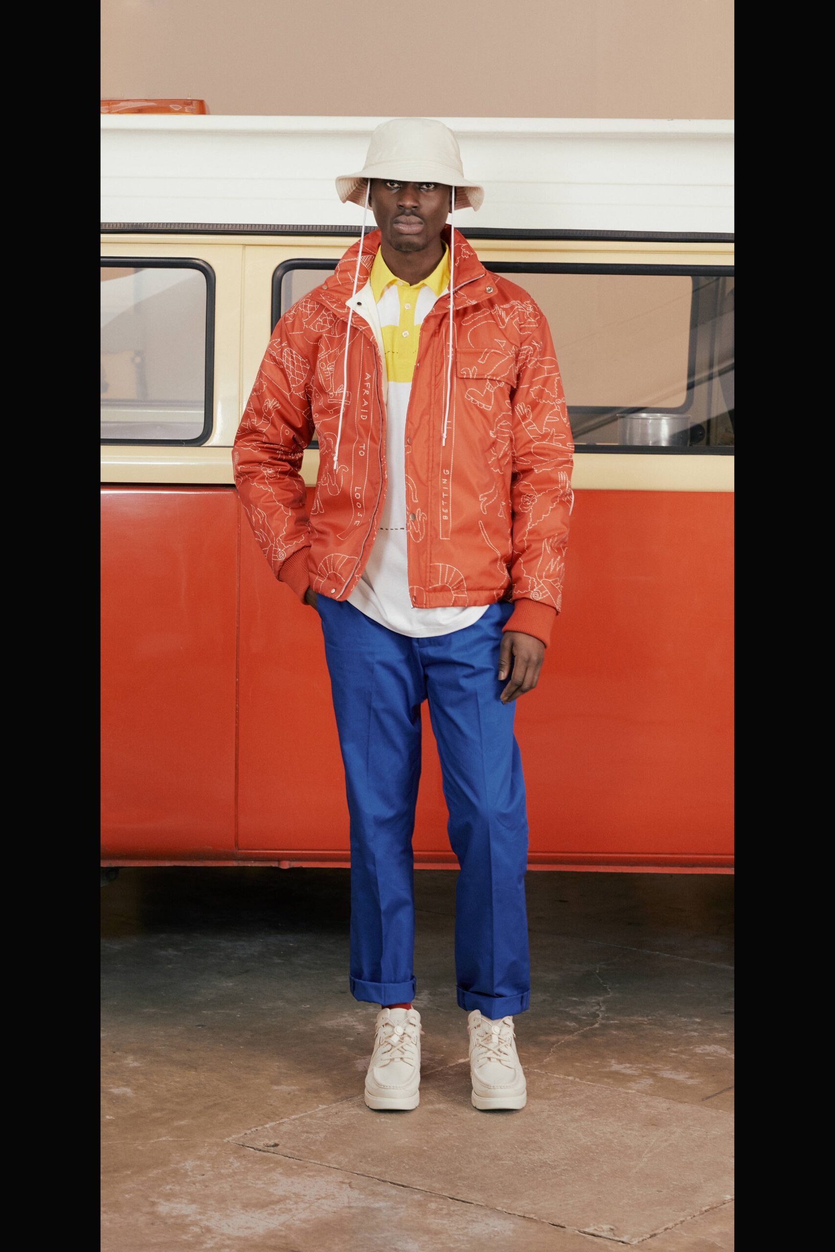 orange jacket with blue pants