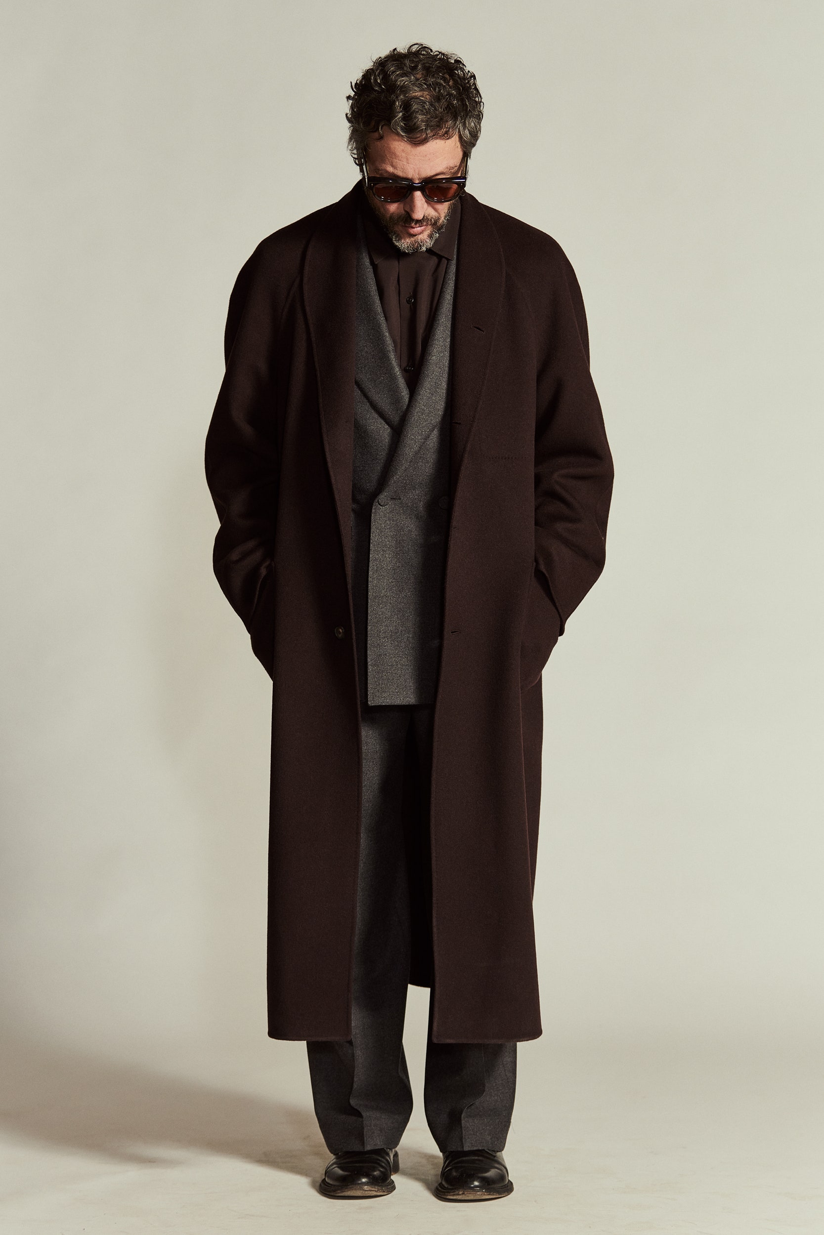 brown wool coat and gray suit