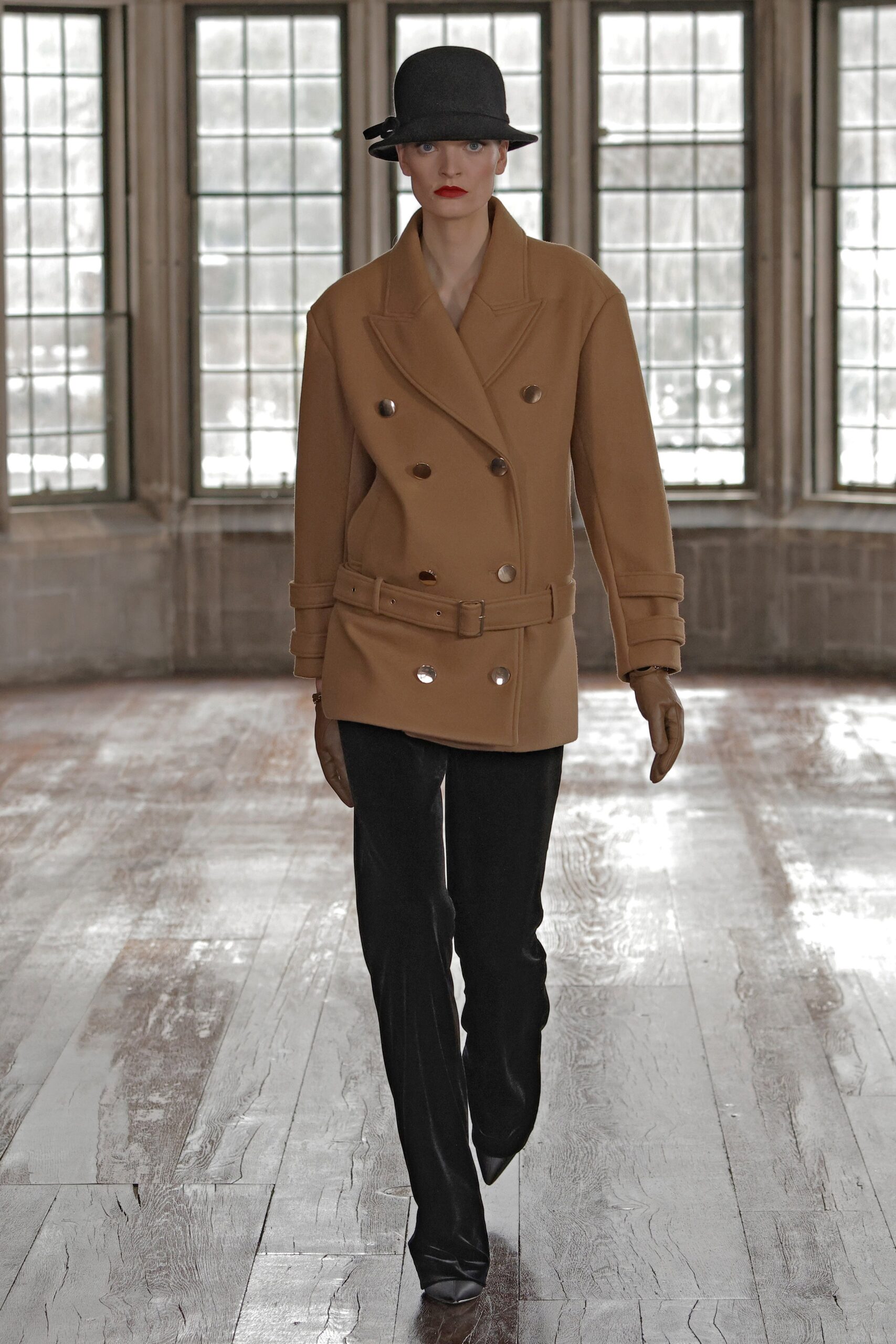 brown tailored coat with black pants