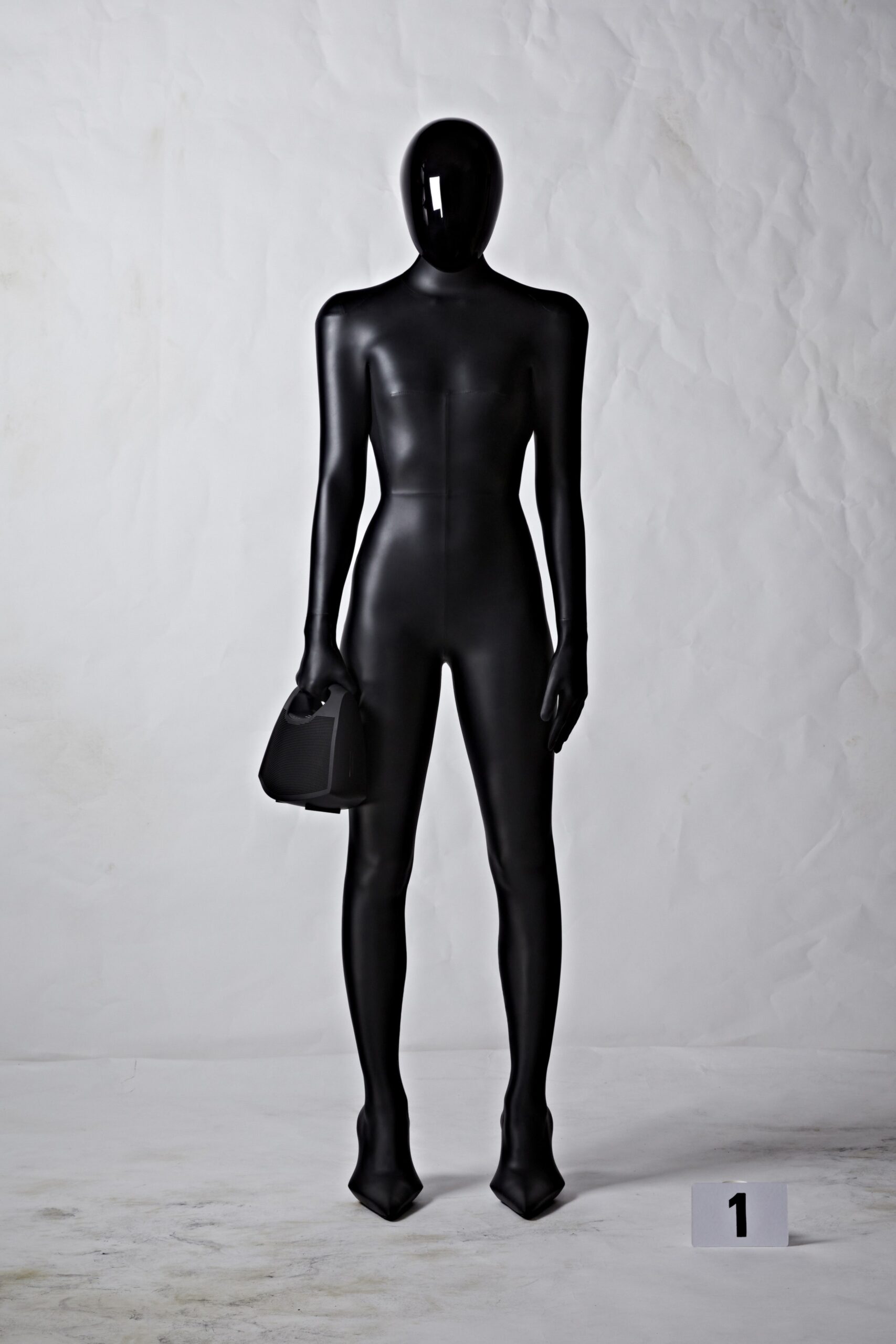 black fitted vinyl catsuit