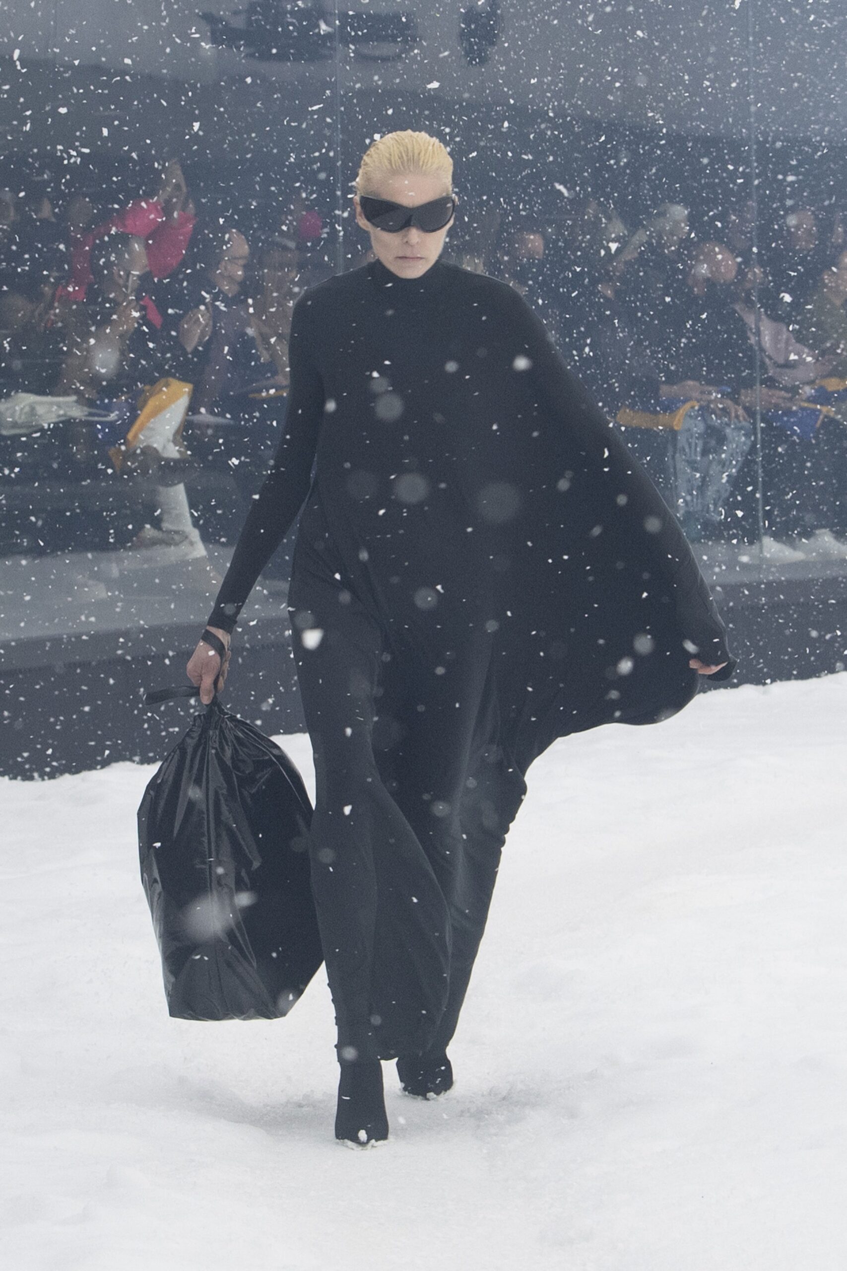 black oversized cape with fitted pants