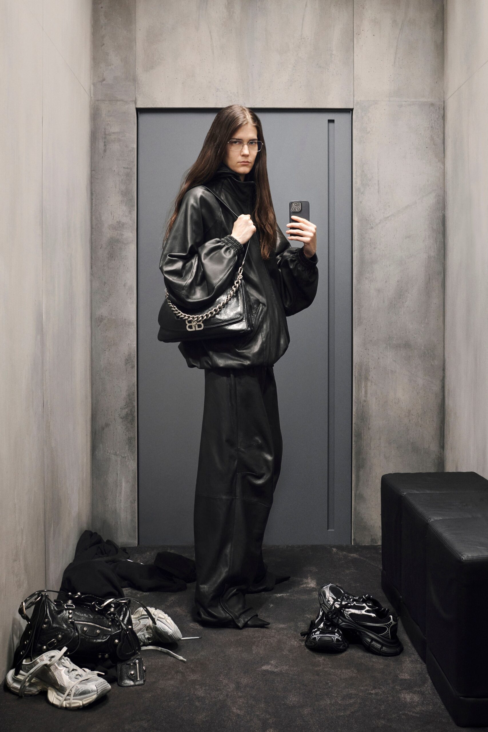 black leather oversized jacket and relaxed pants
