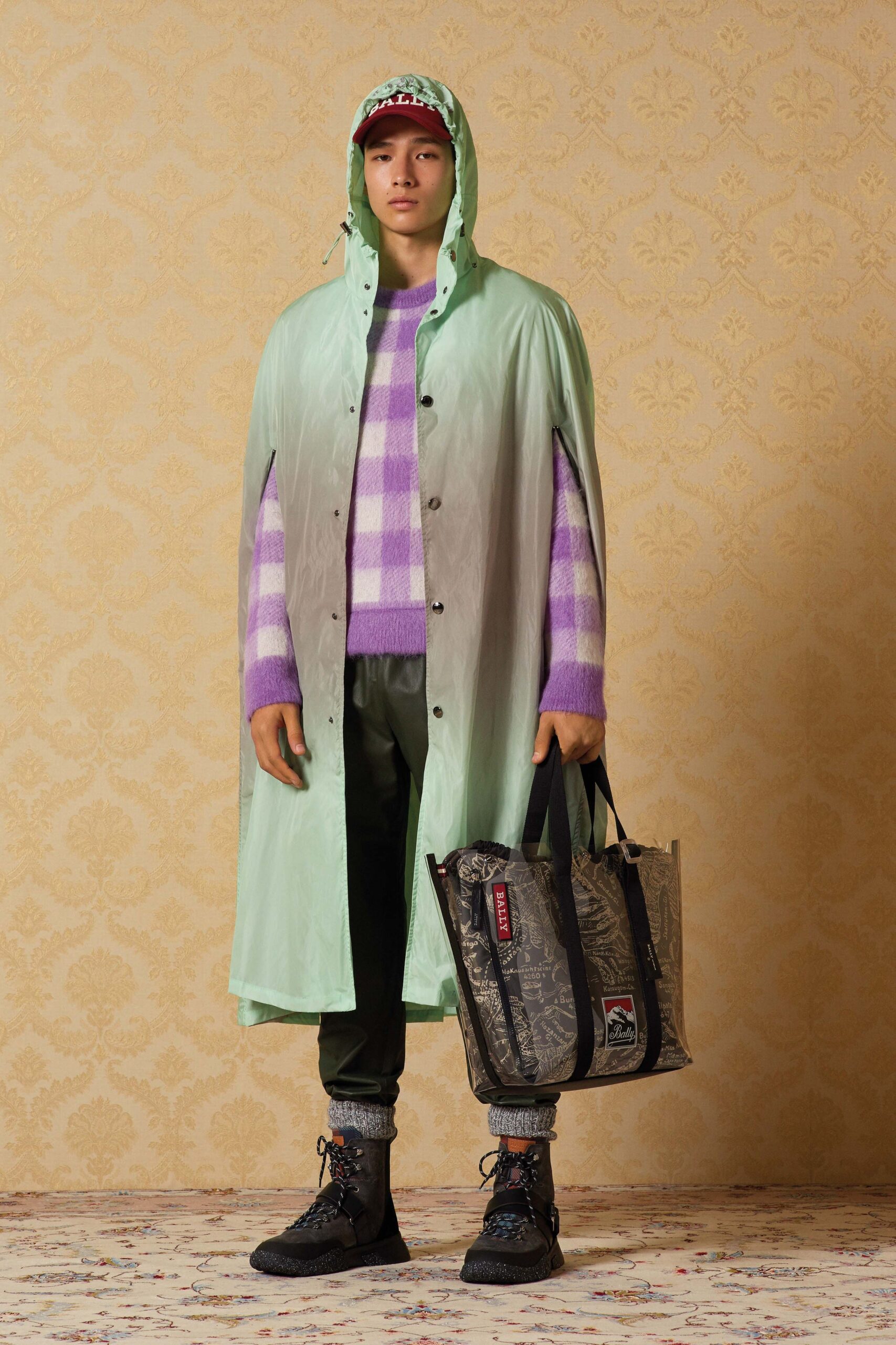 green vinyl cape with purple sweater