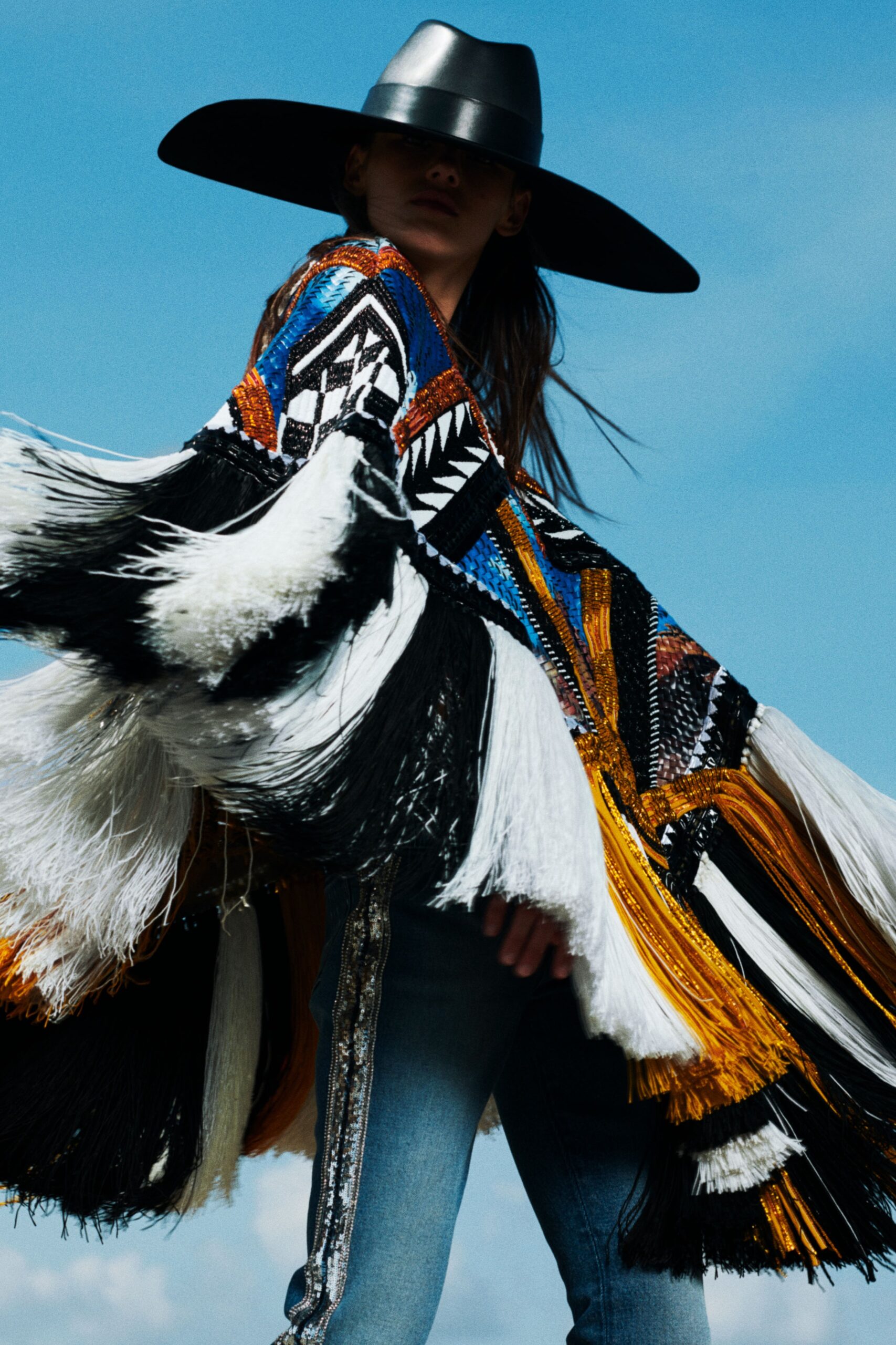 colorful fringed poncho with jeans