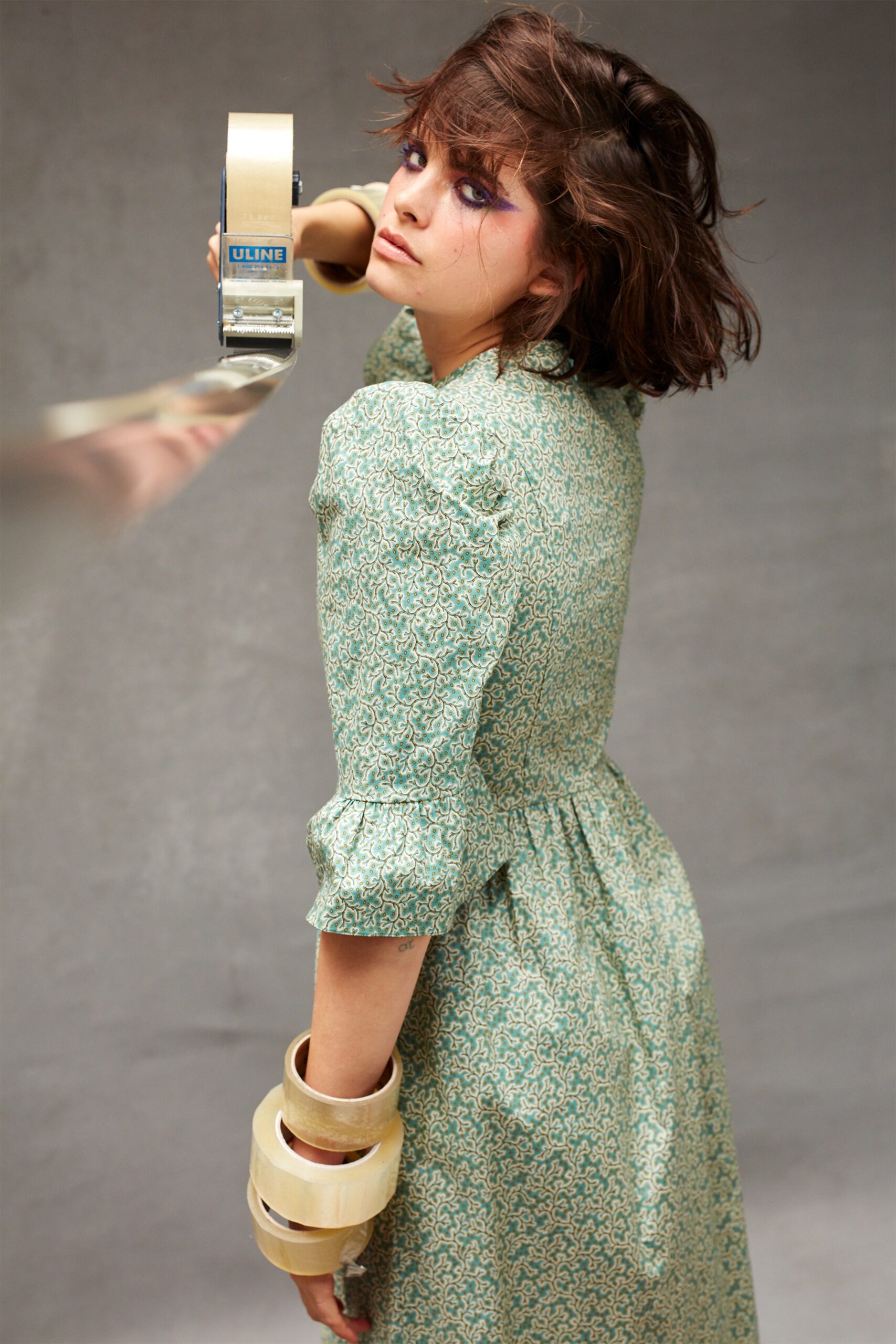 green cotton midi dress with layered bracelet