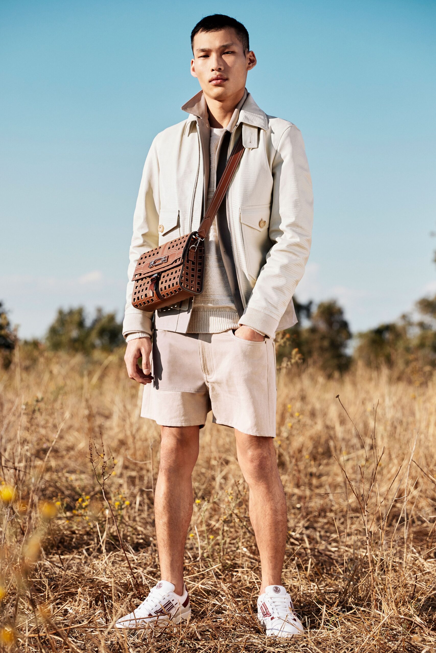 white fitted jacket with beige shorts
