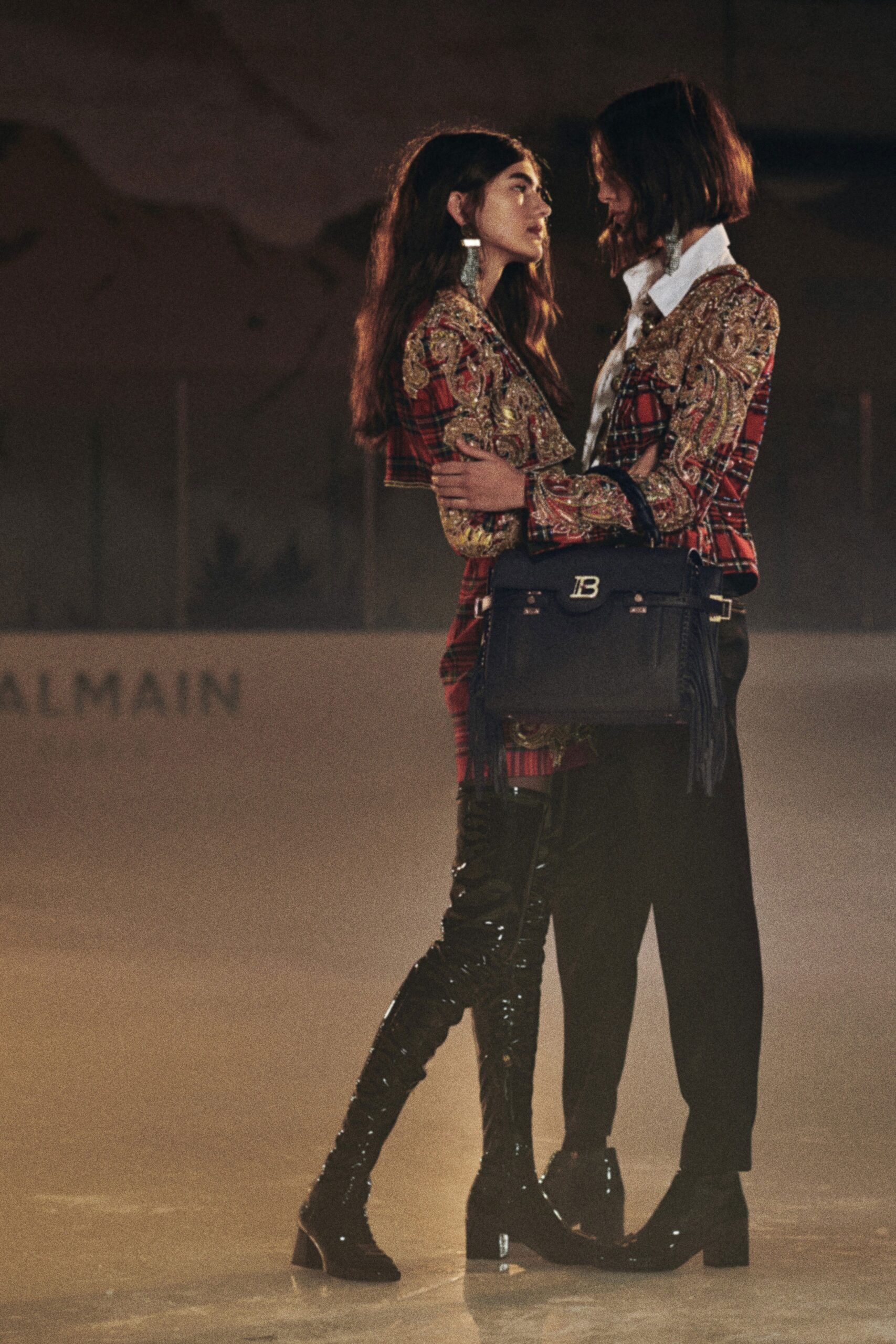 multi-colored tailored blazer and red mini dress