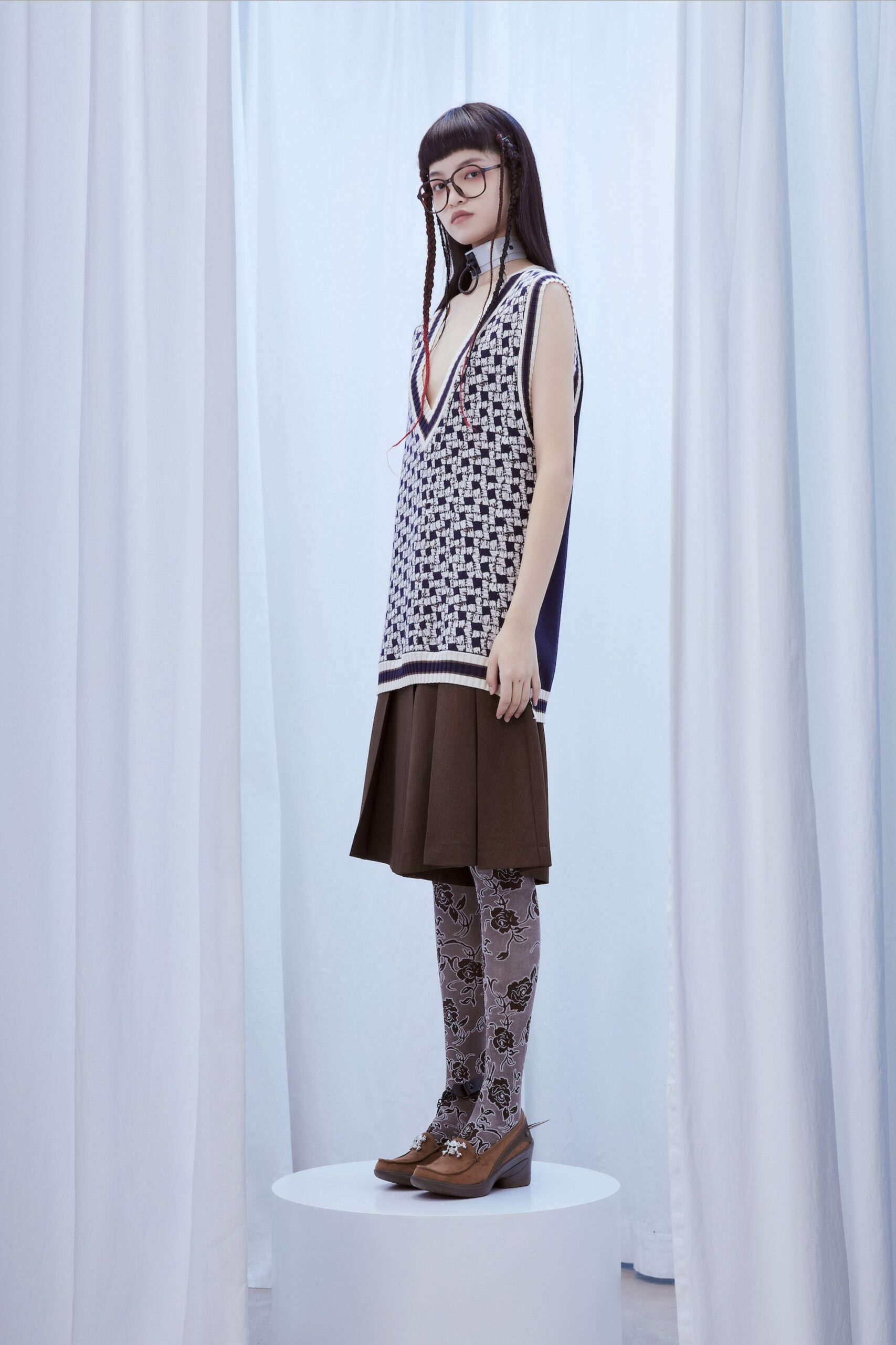 blue and white layered top with brown skirt