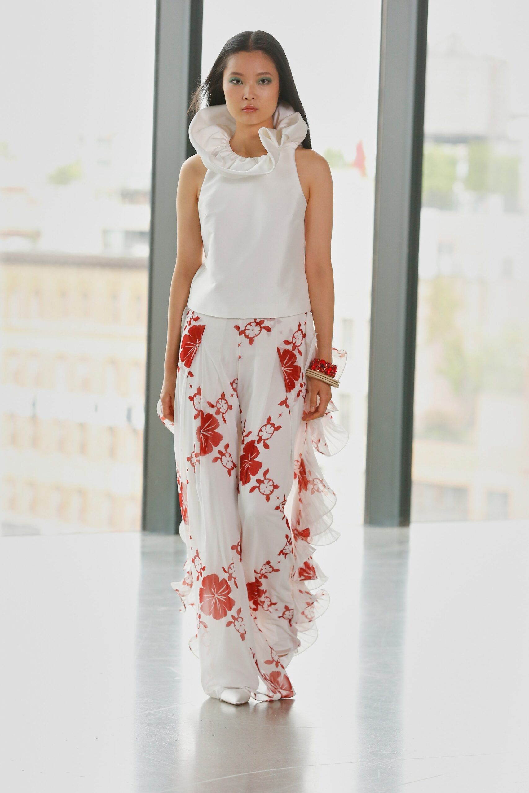 white silk ruffled top with floral pants