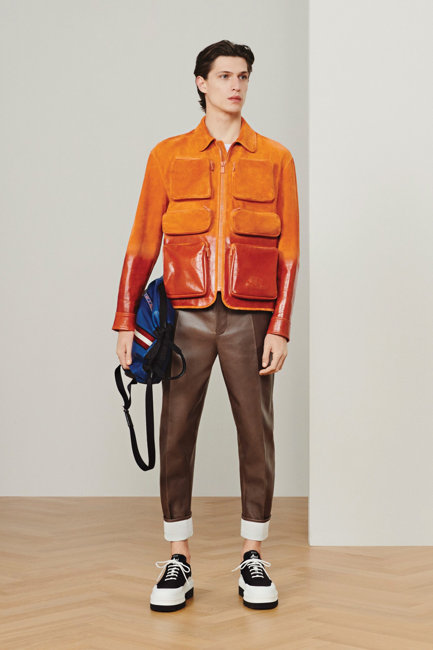 orange leather long-sleeve collared fitted zippered pockets jacket