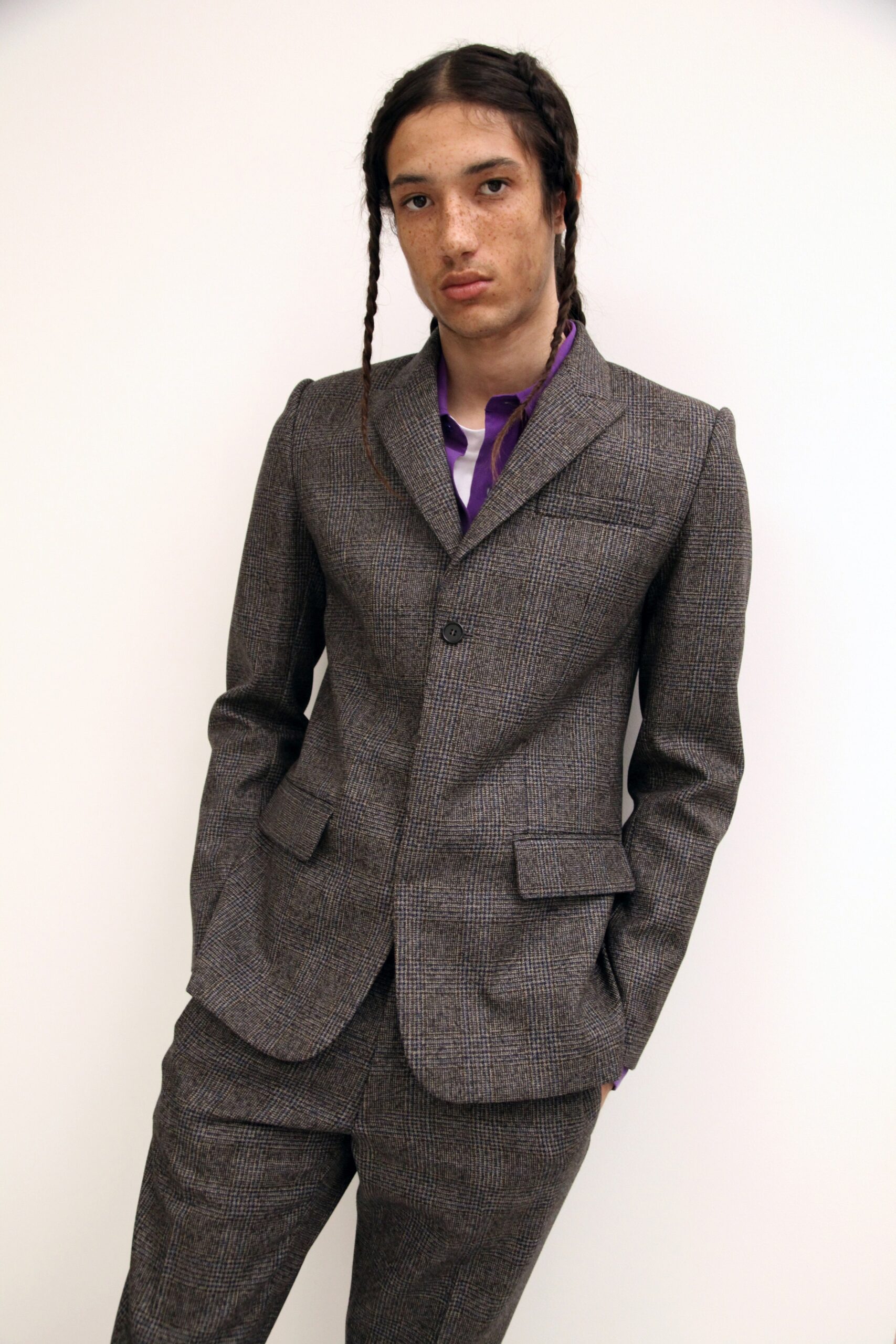 gray tailored suit with purple shirt