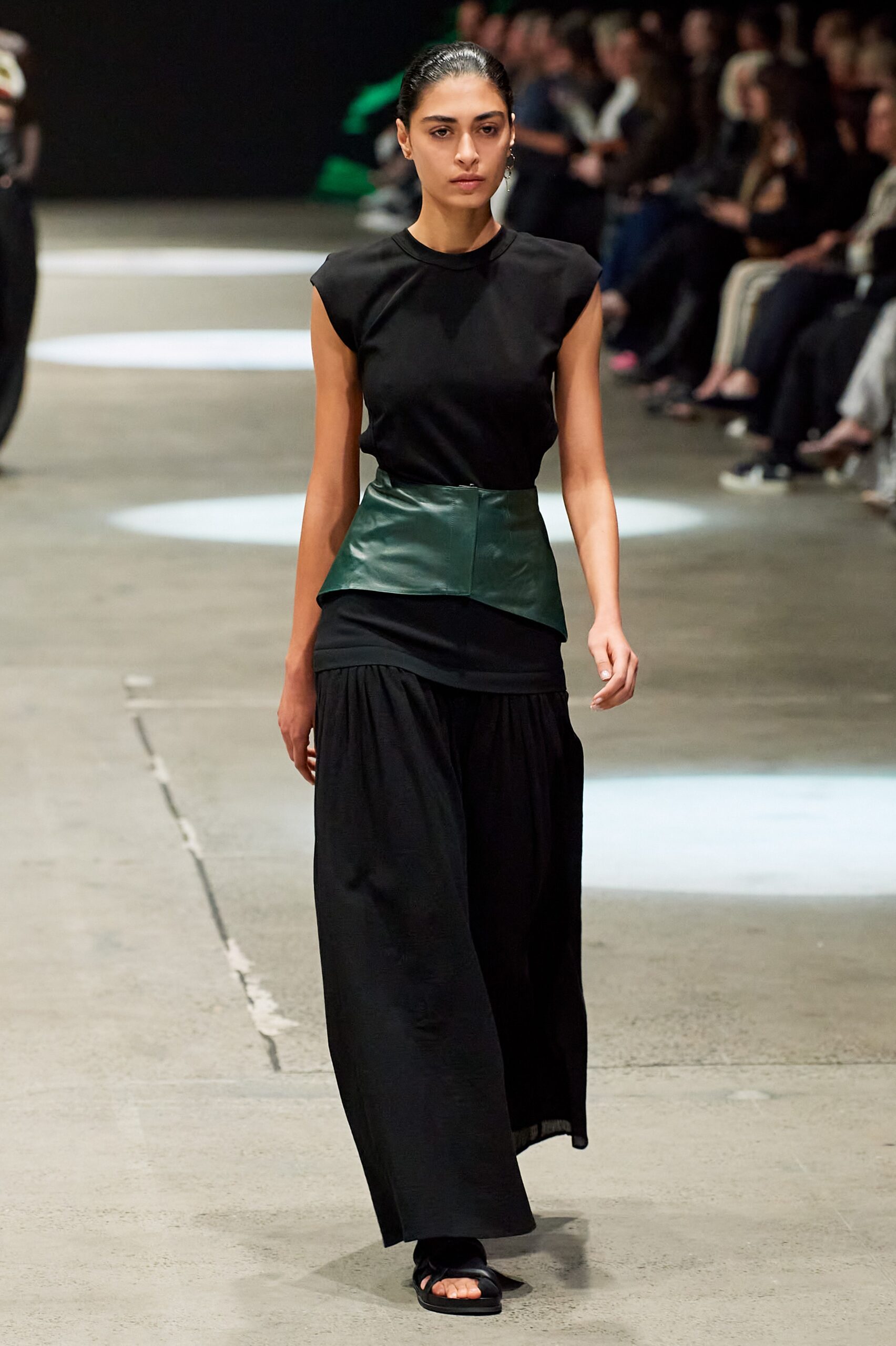 black fitted top with pleated skirt