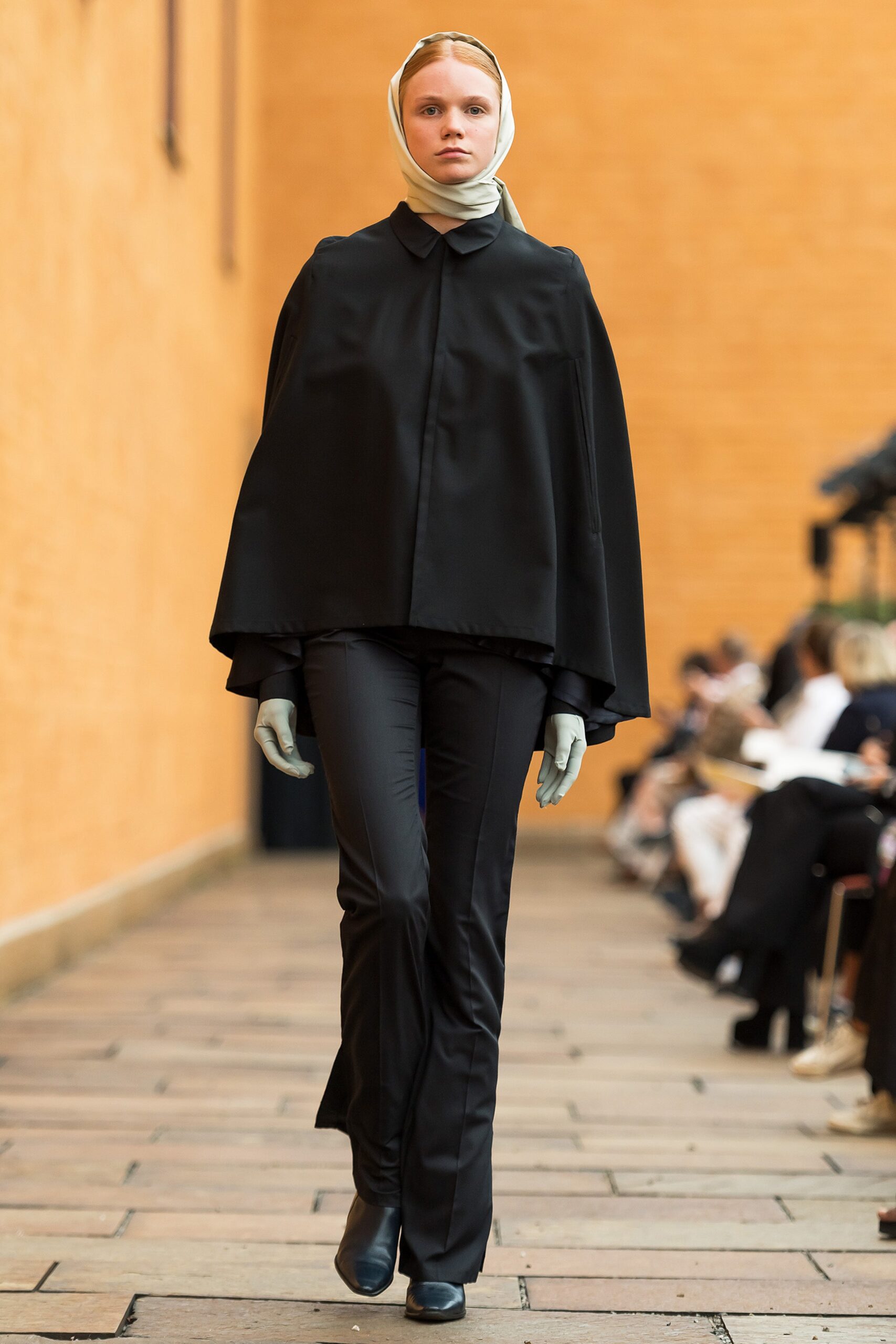 black collared flowing cape