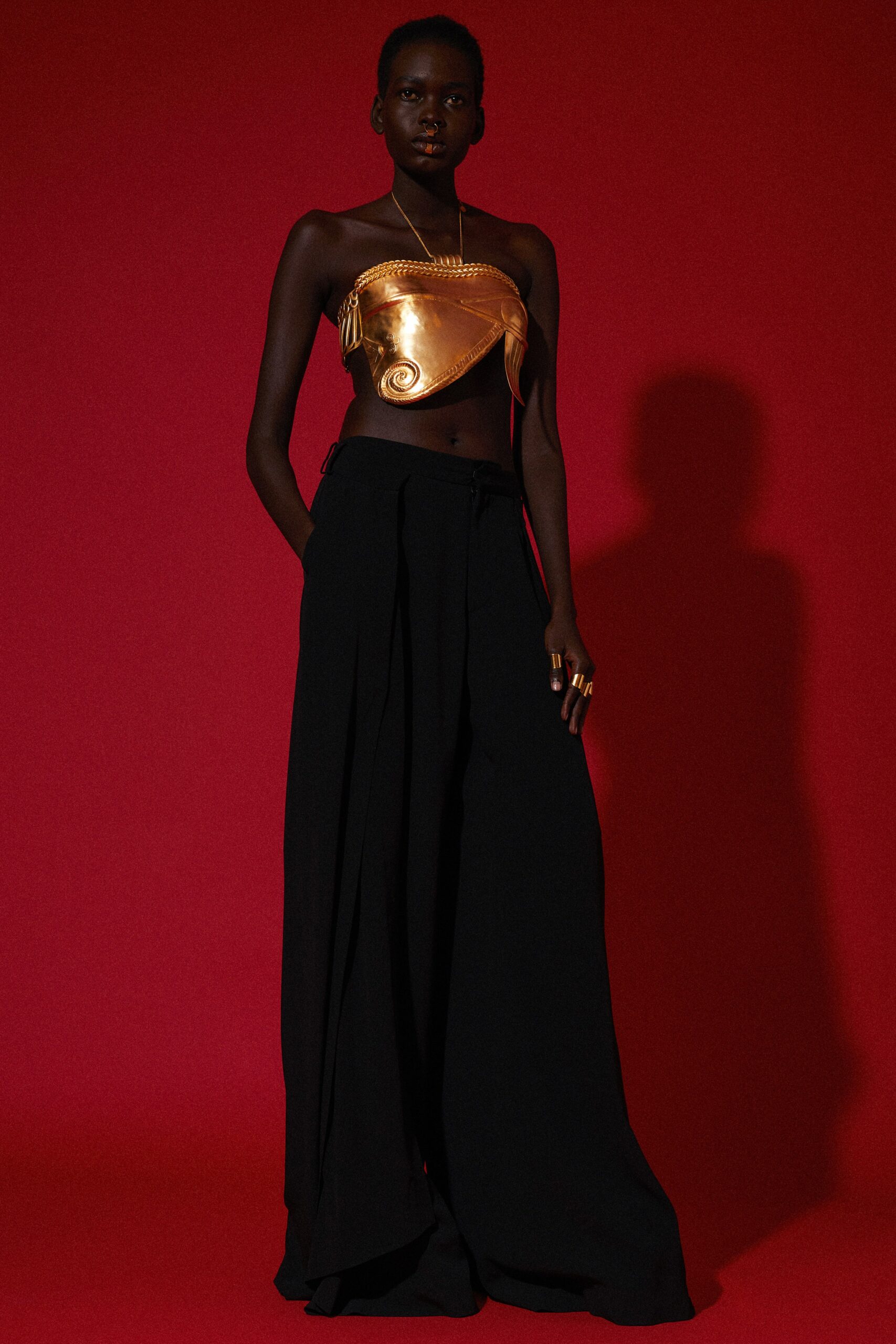 black relaxed pants with gold top