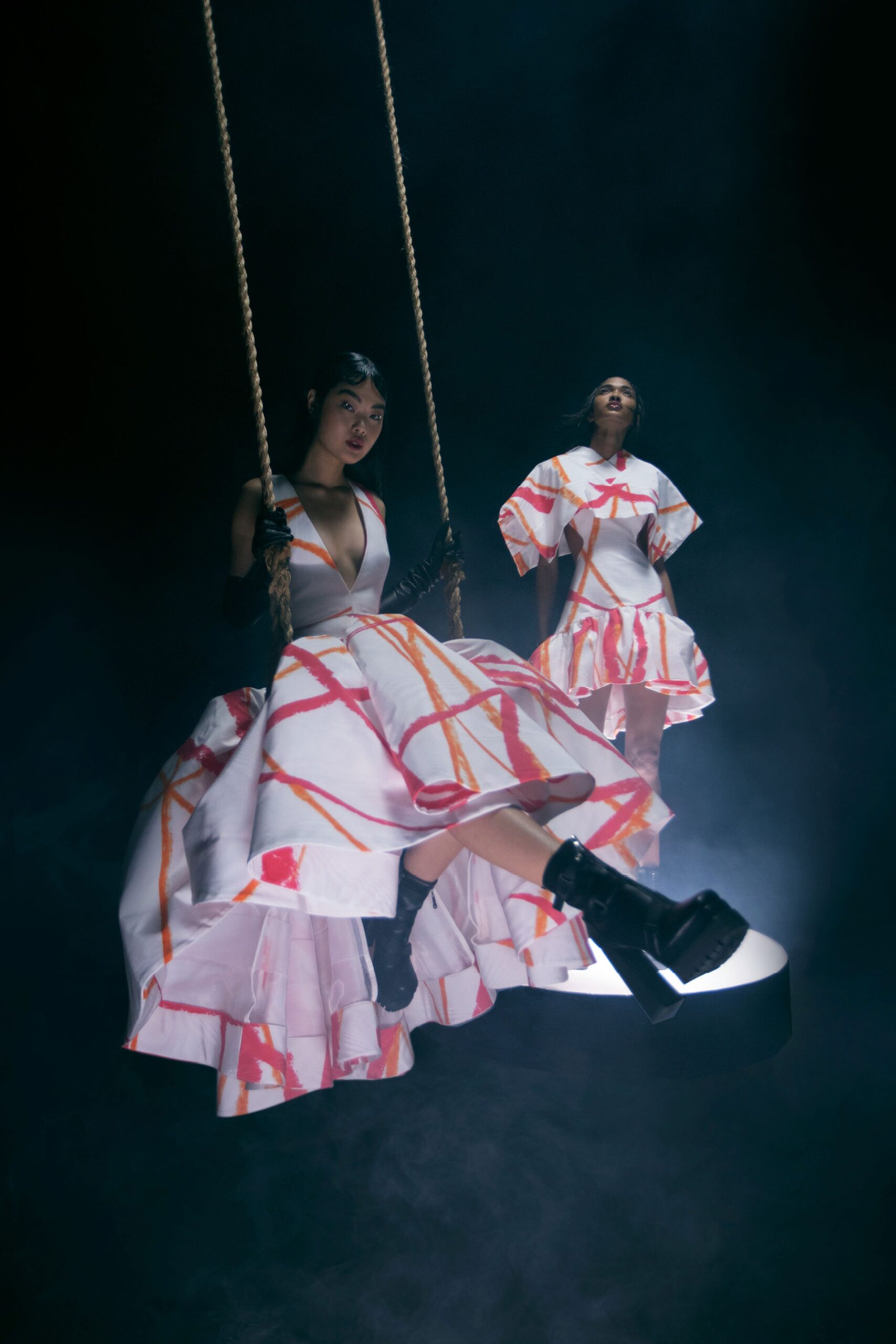 white and orange tiered dresses