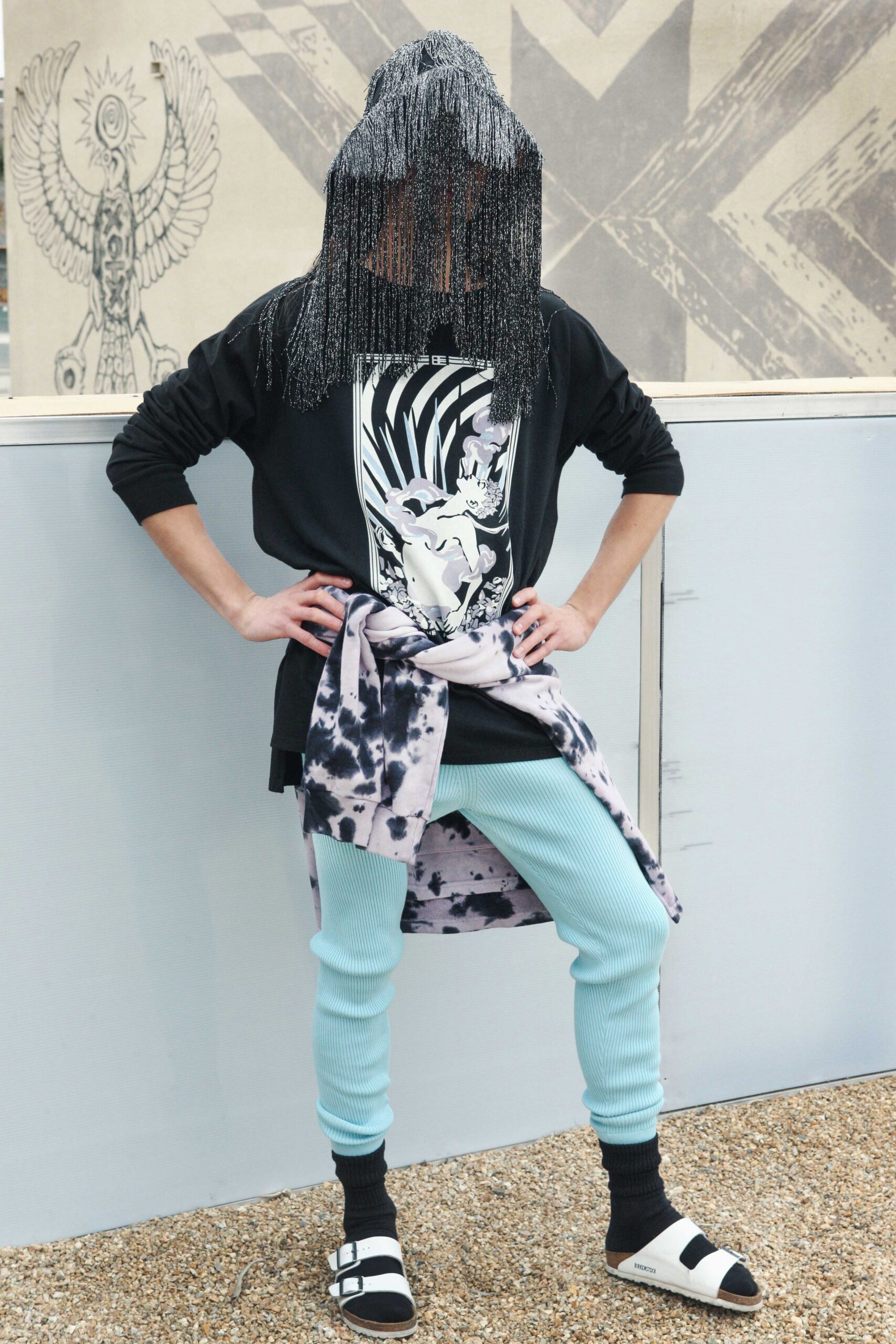 relaxed black top with blue pants