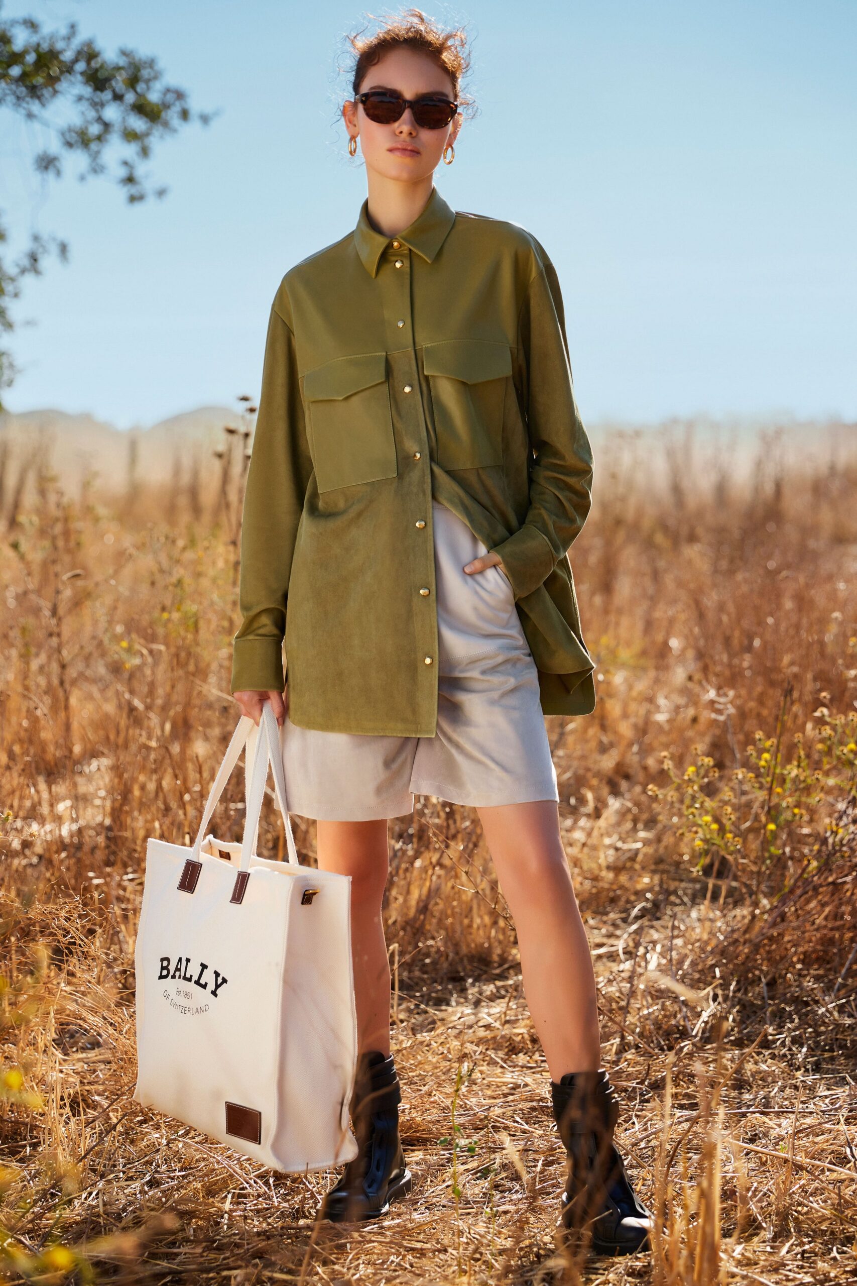 green relaxed shirt with beige shorts