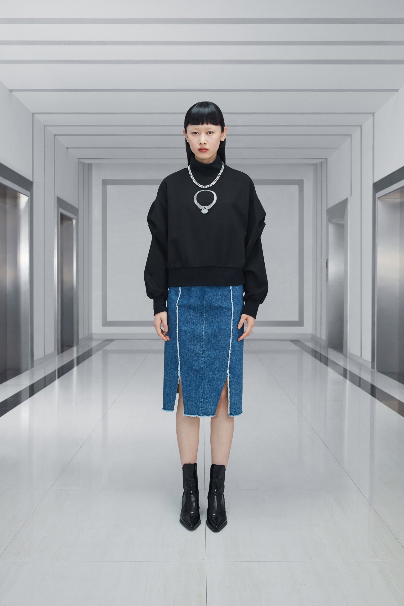 oversized black sweater and denim skirt