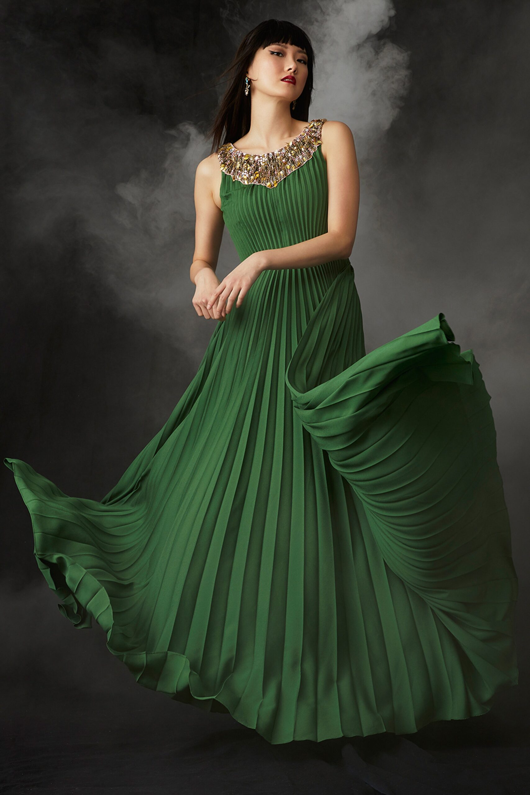 green pleated sleeveless gown