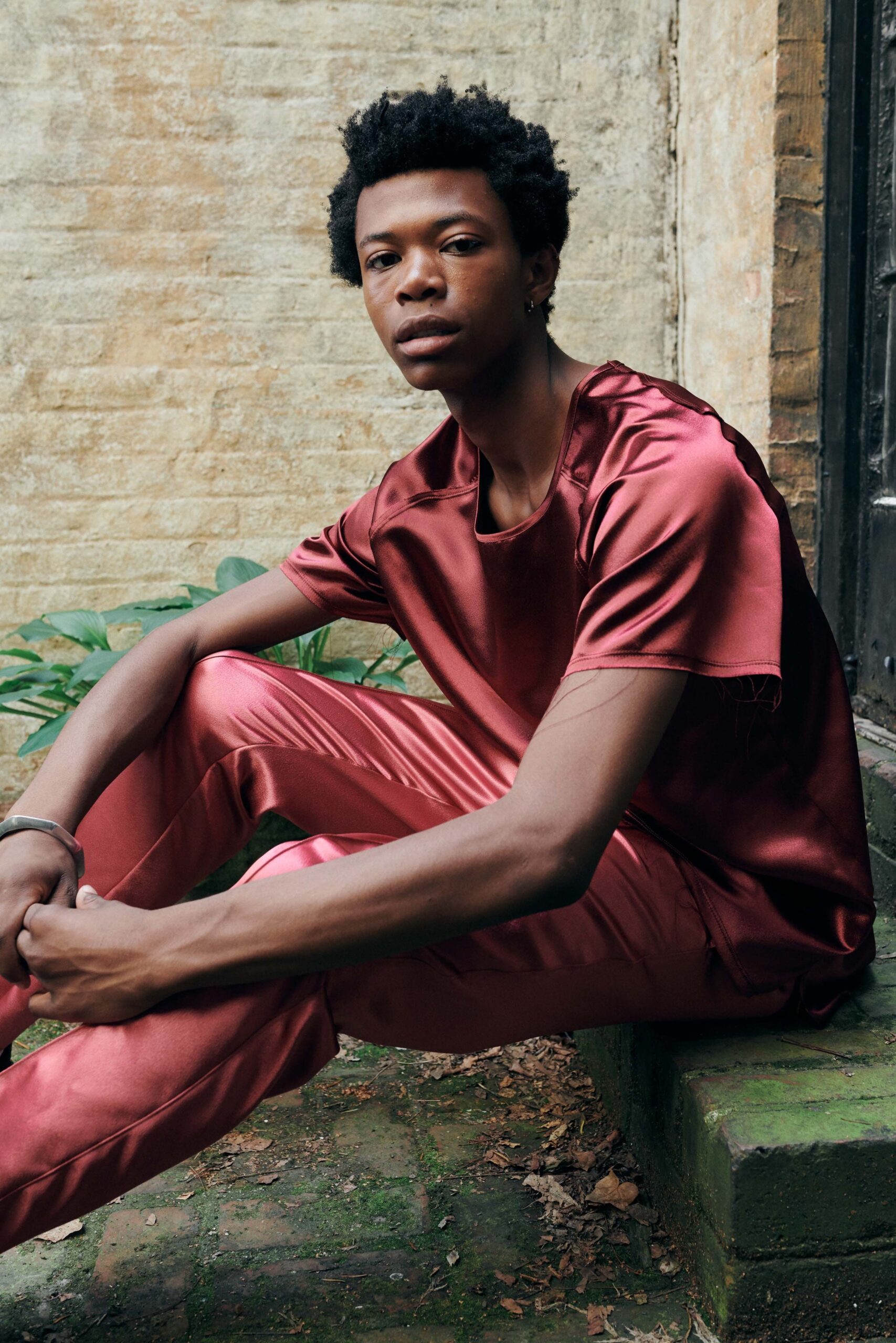 red silk relaxed top and fitted pants