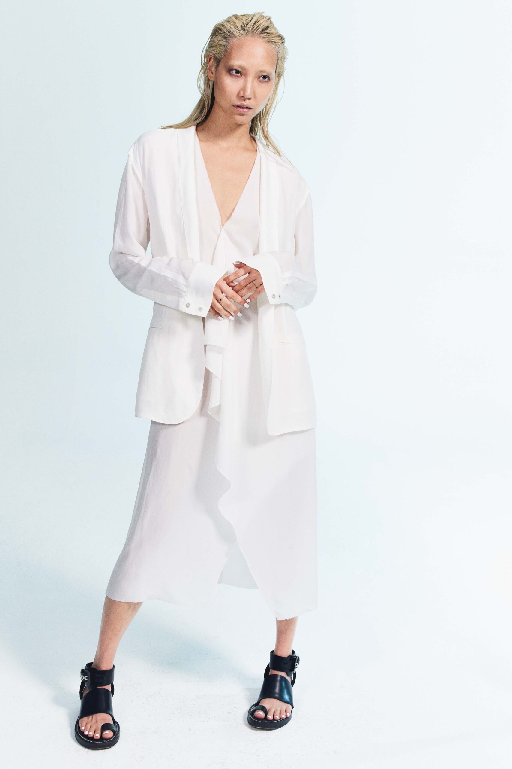 white silk long-sleeve collared relaxed buttoned jacket