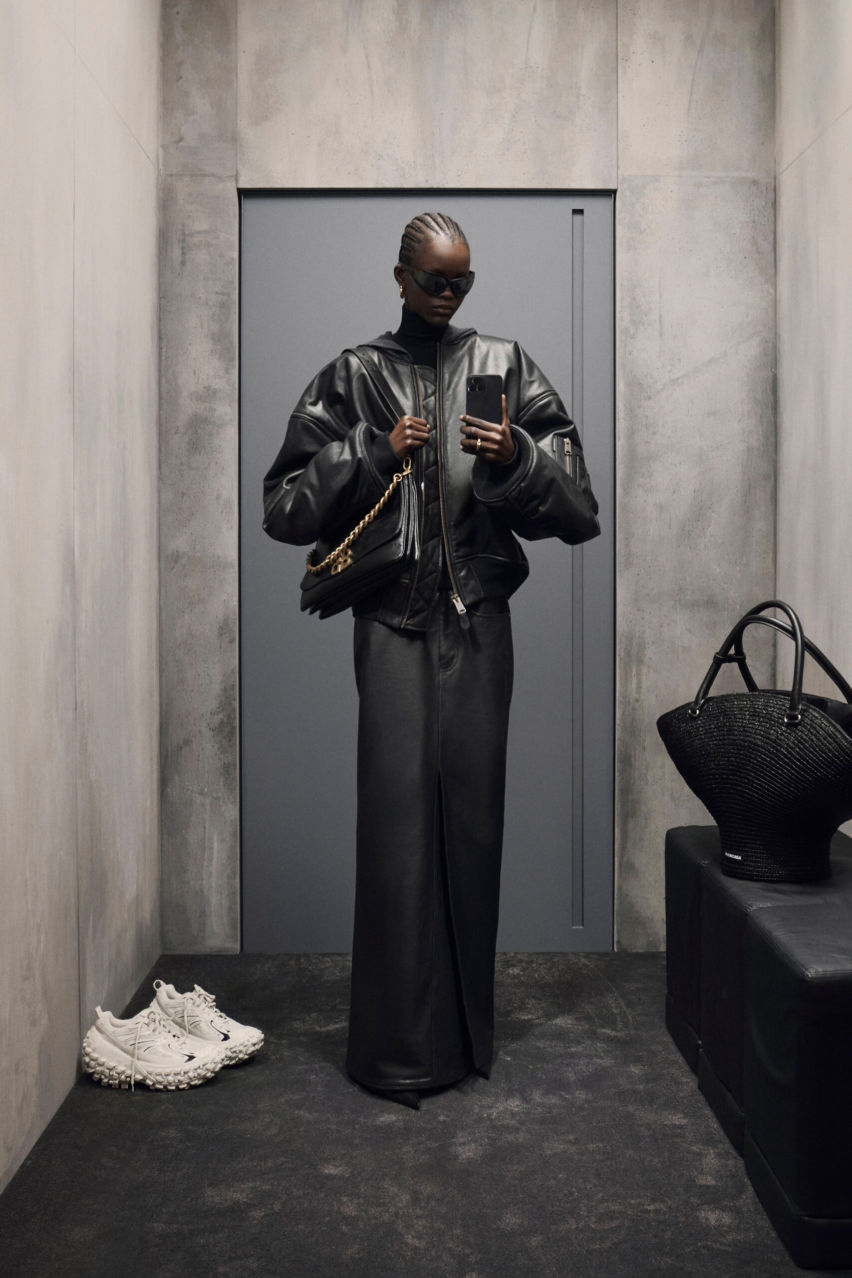 black leather oversized jacket and fitted skirt