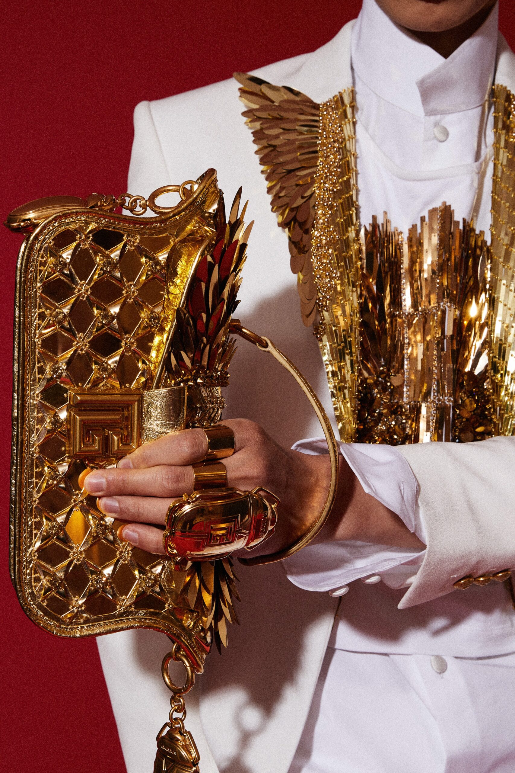 white tailored blazer with gold top