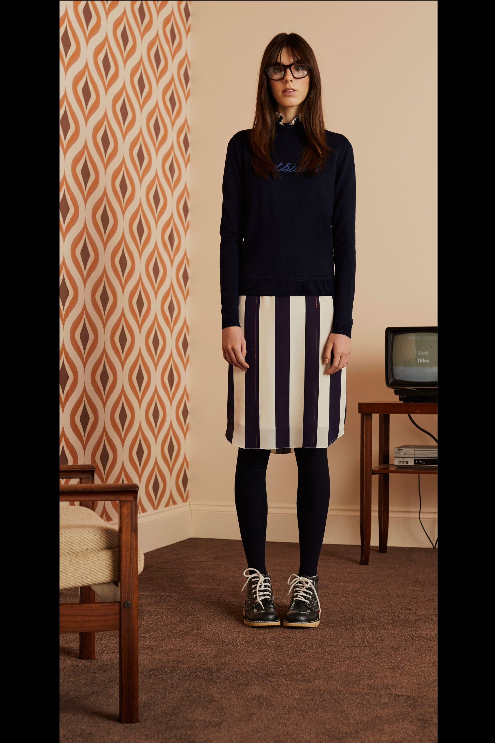 navy top with striped skirt