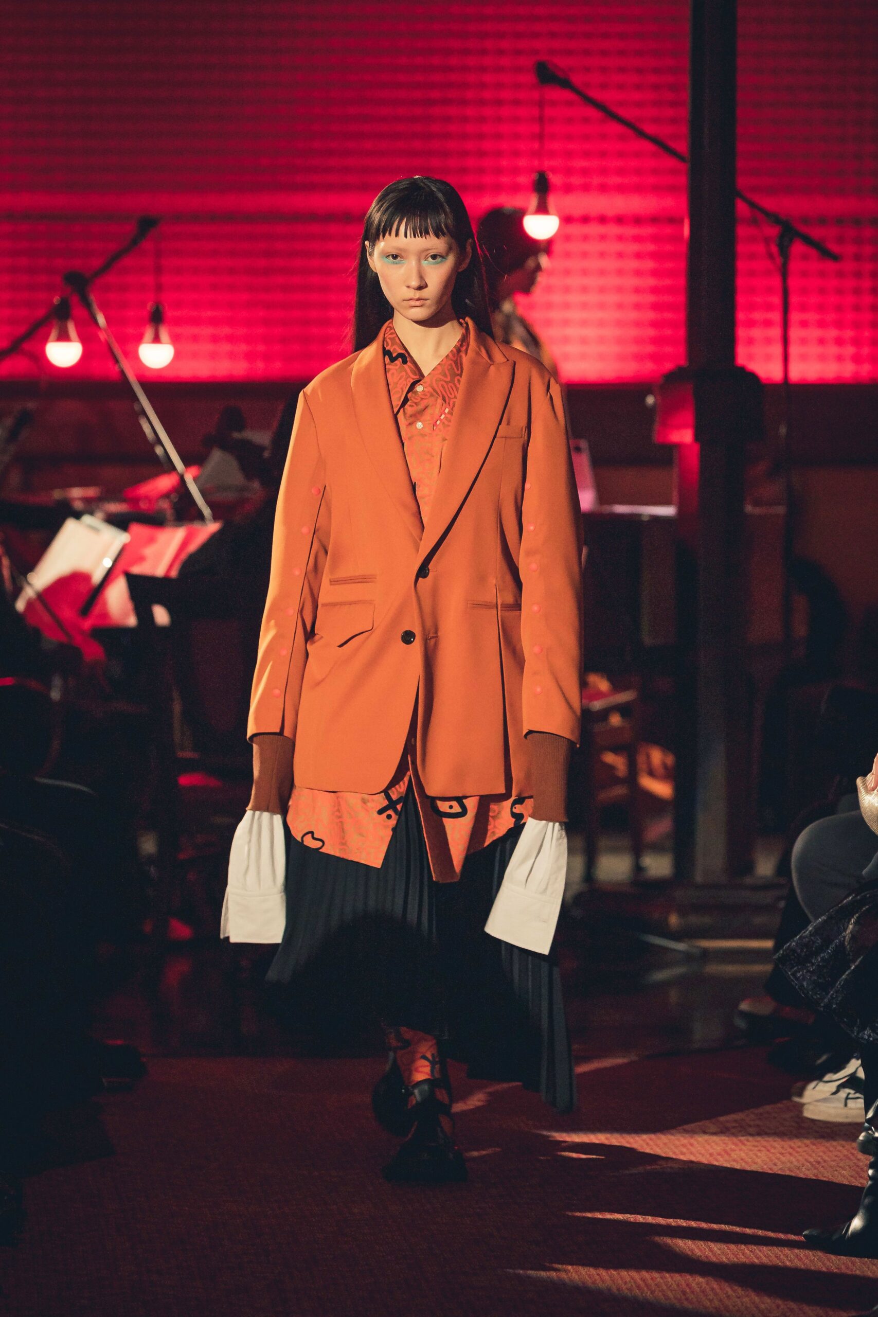 orange tailored blazer with red shirt