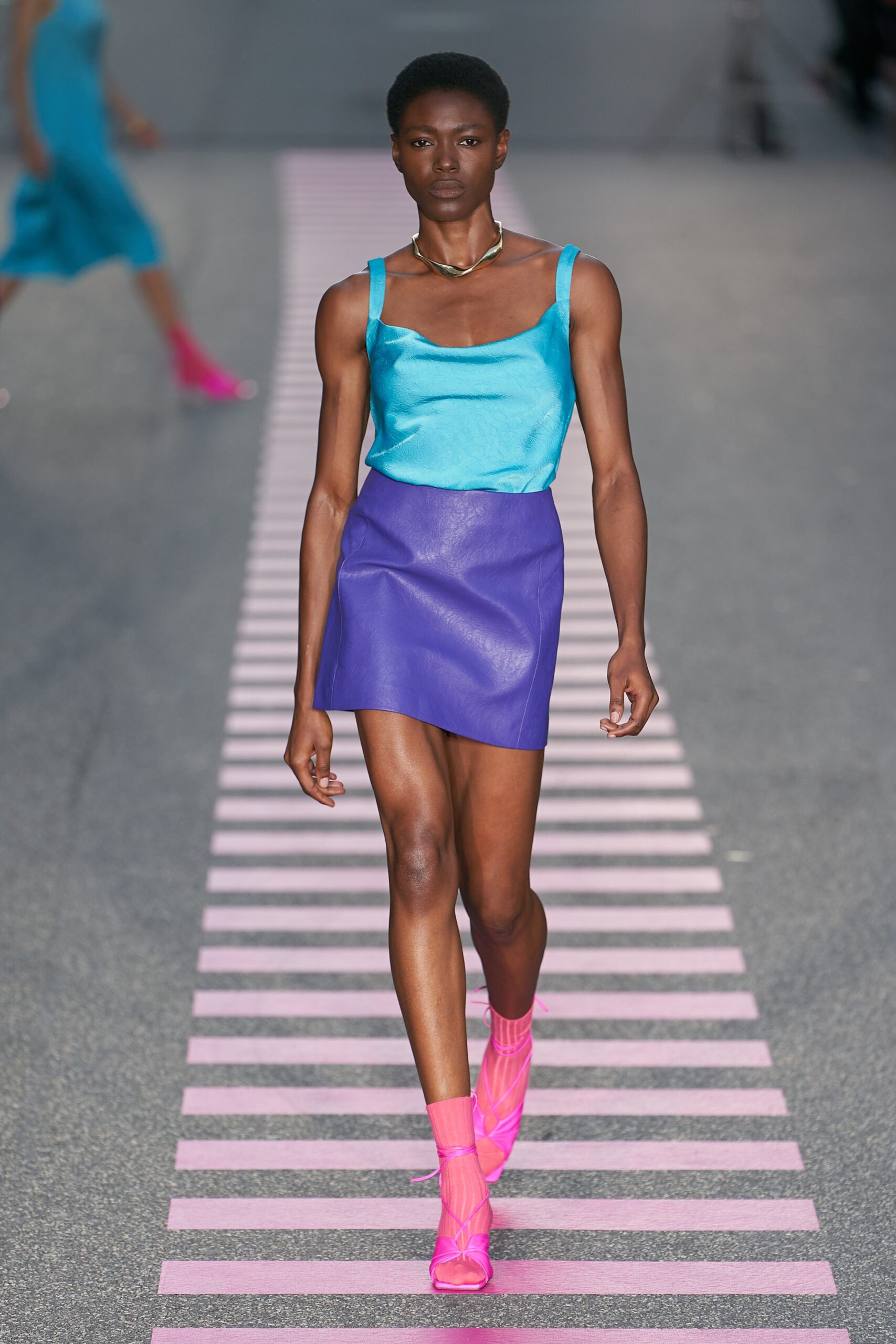 blue sleeveless top and purple skirt