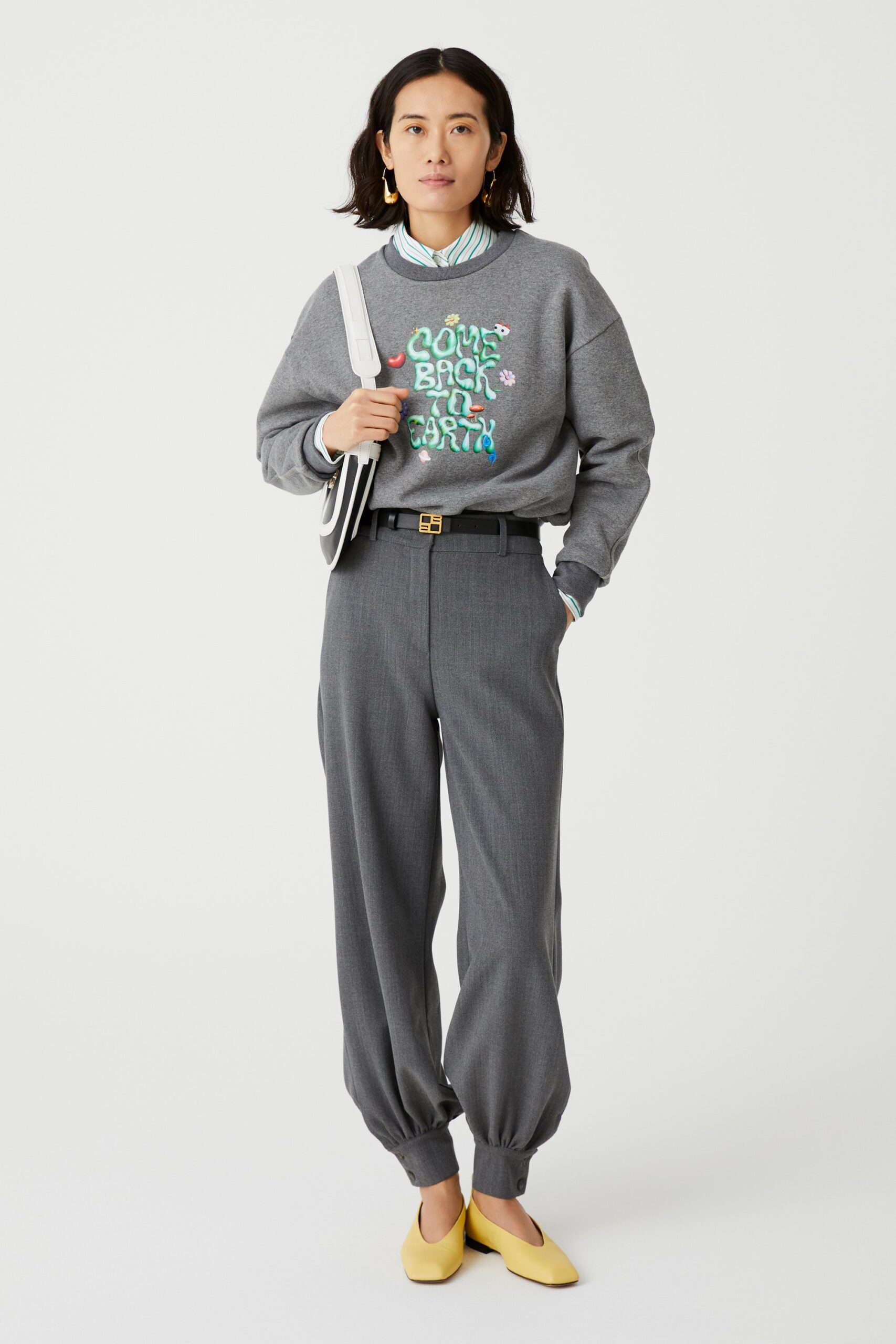 gray relaxed sweater with pleated pants