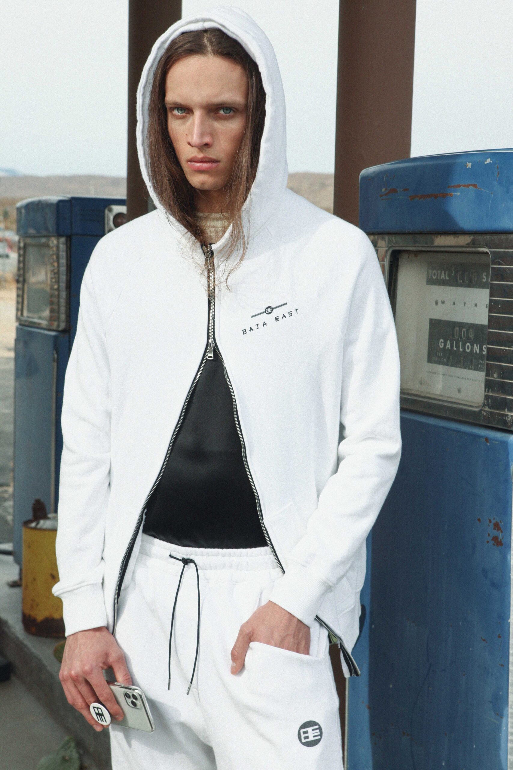 white hoodie black tank-top white pants