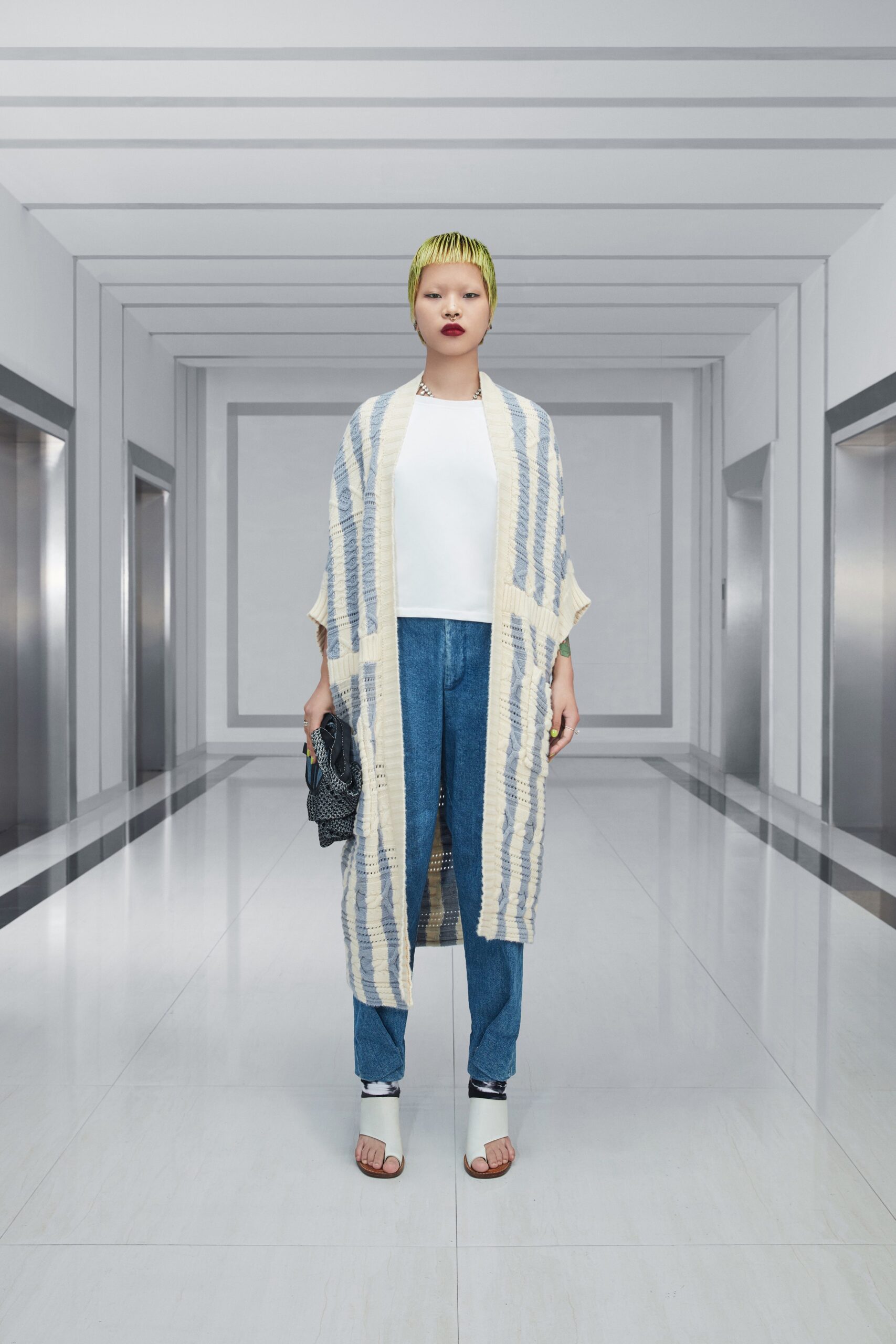 white sleeveless top with denim pants