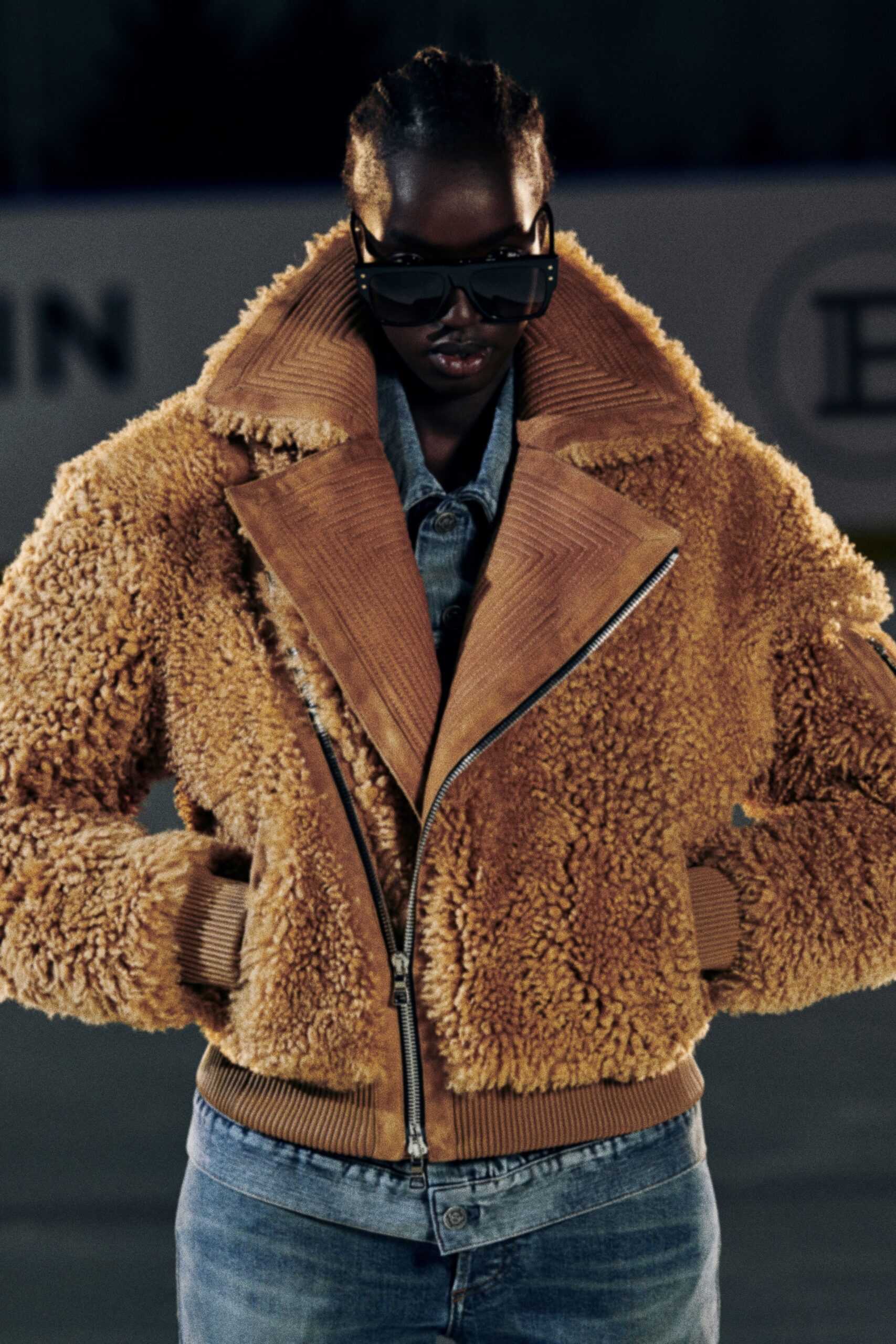 brown faux-fur jacket with denim shirt
