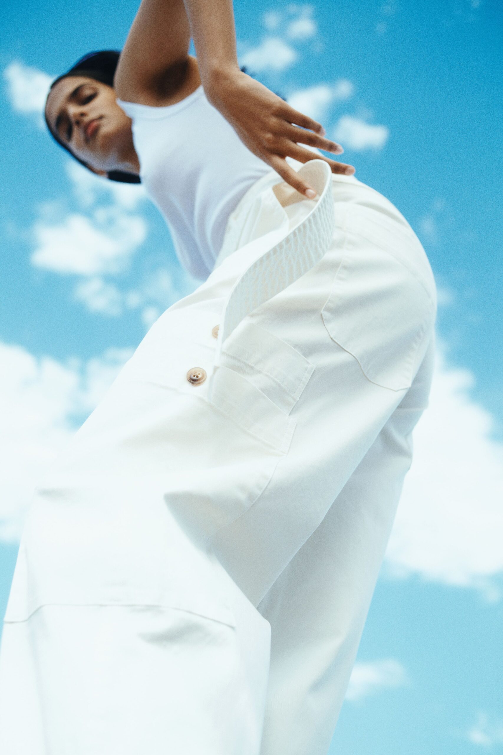 white fitted top and relaxed cargo pants