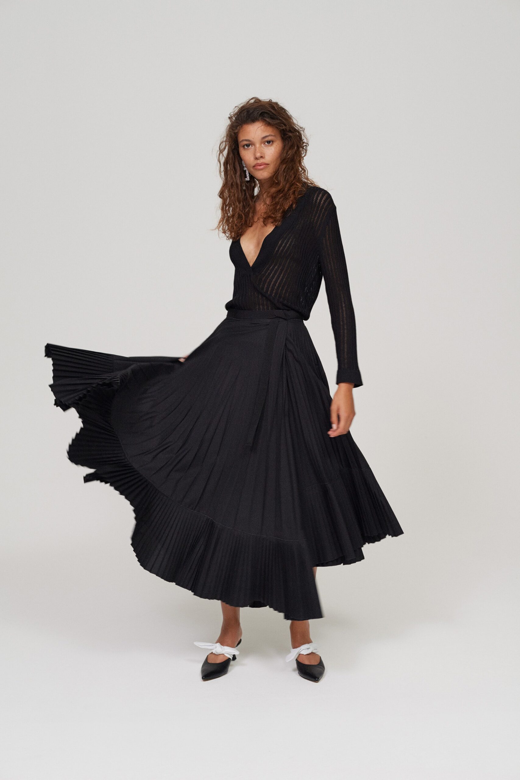 black pleated wrap midi skirt