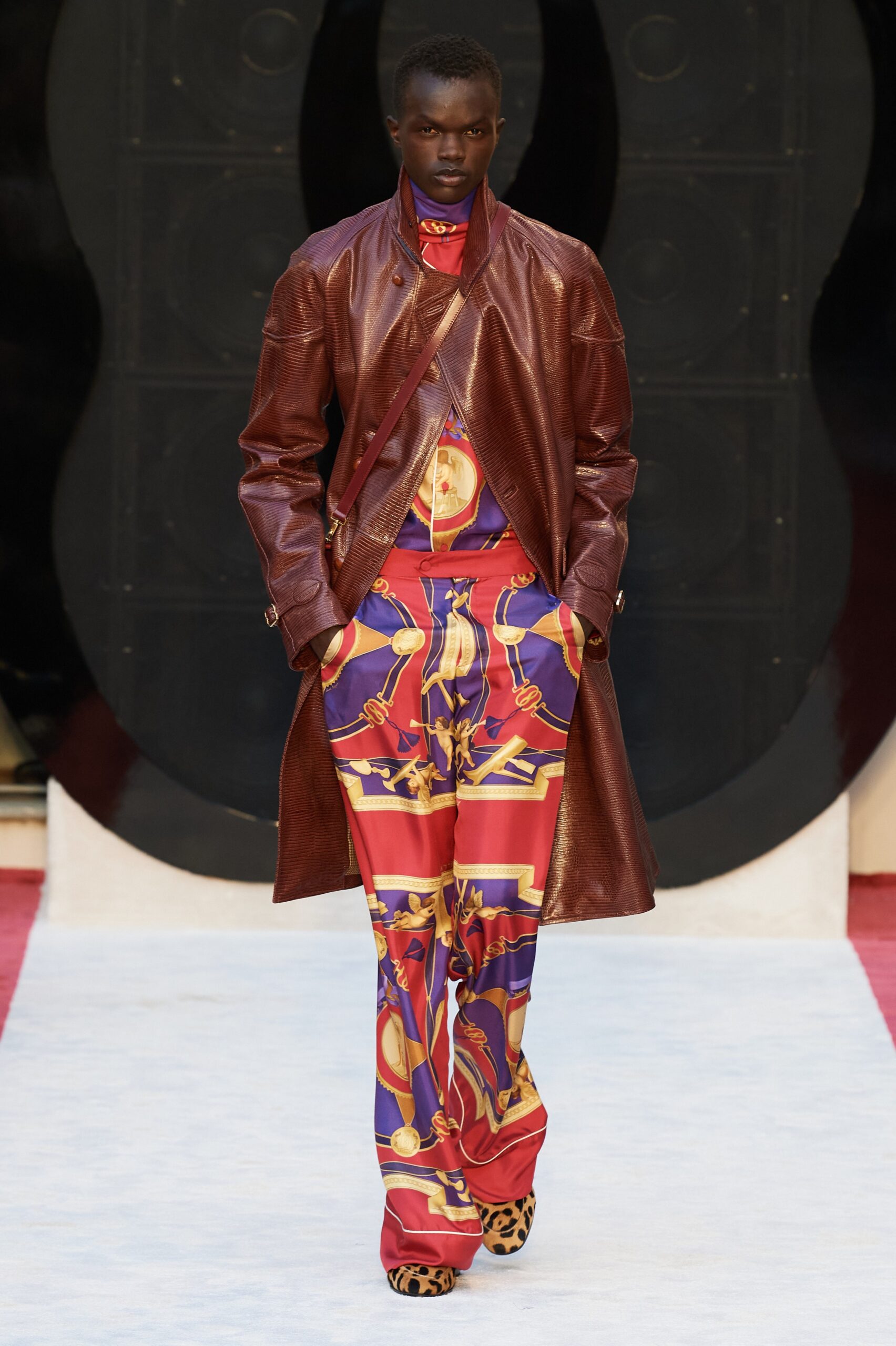 brown leather coat and printed pants