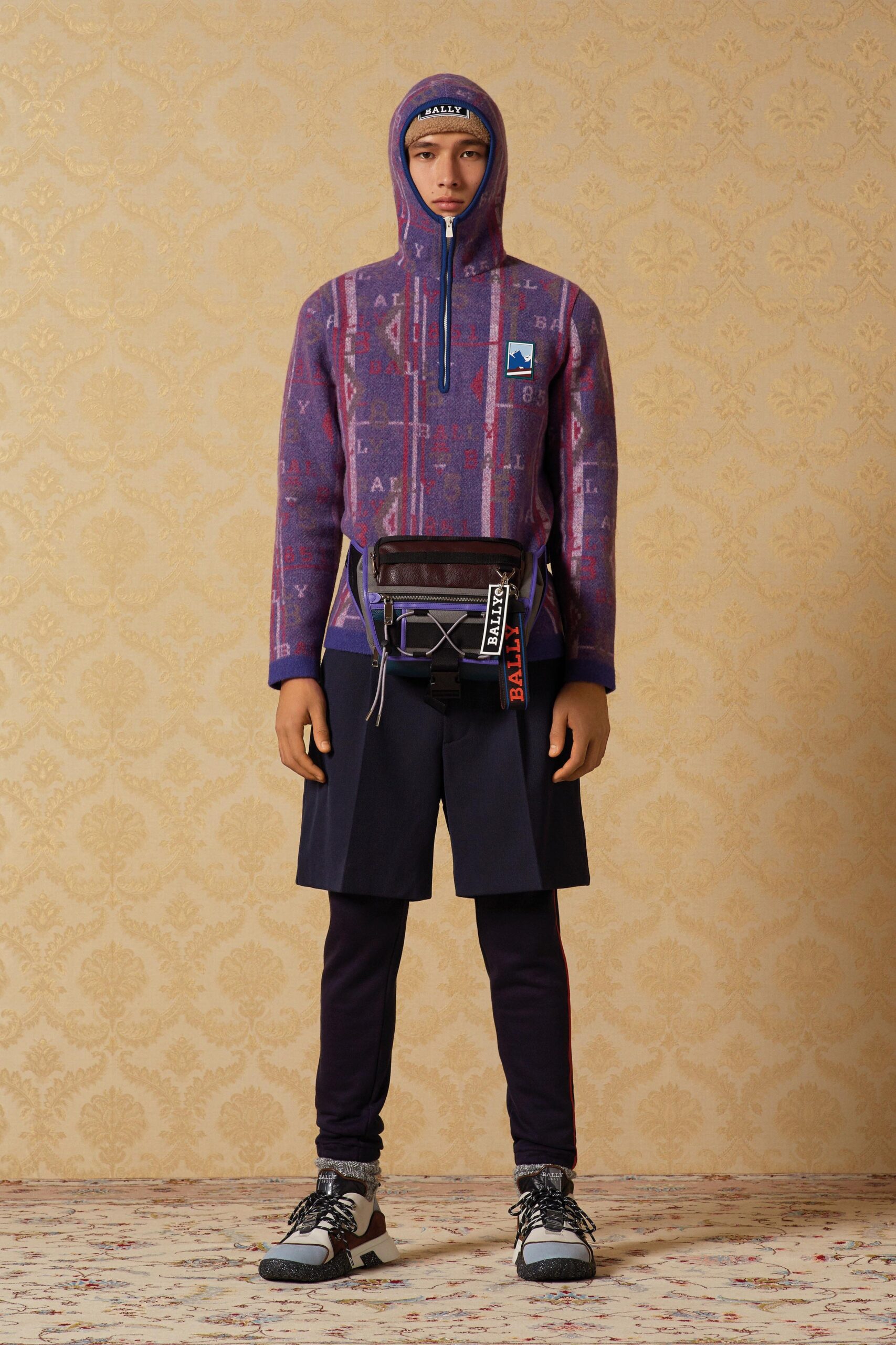 purple hoodie with black shorts