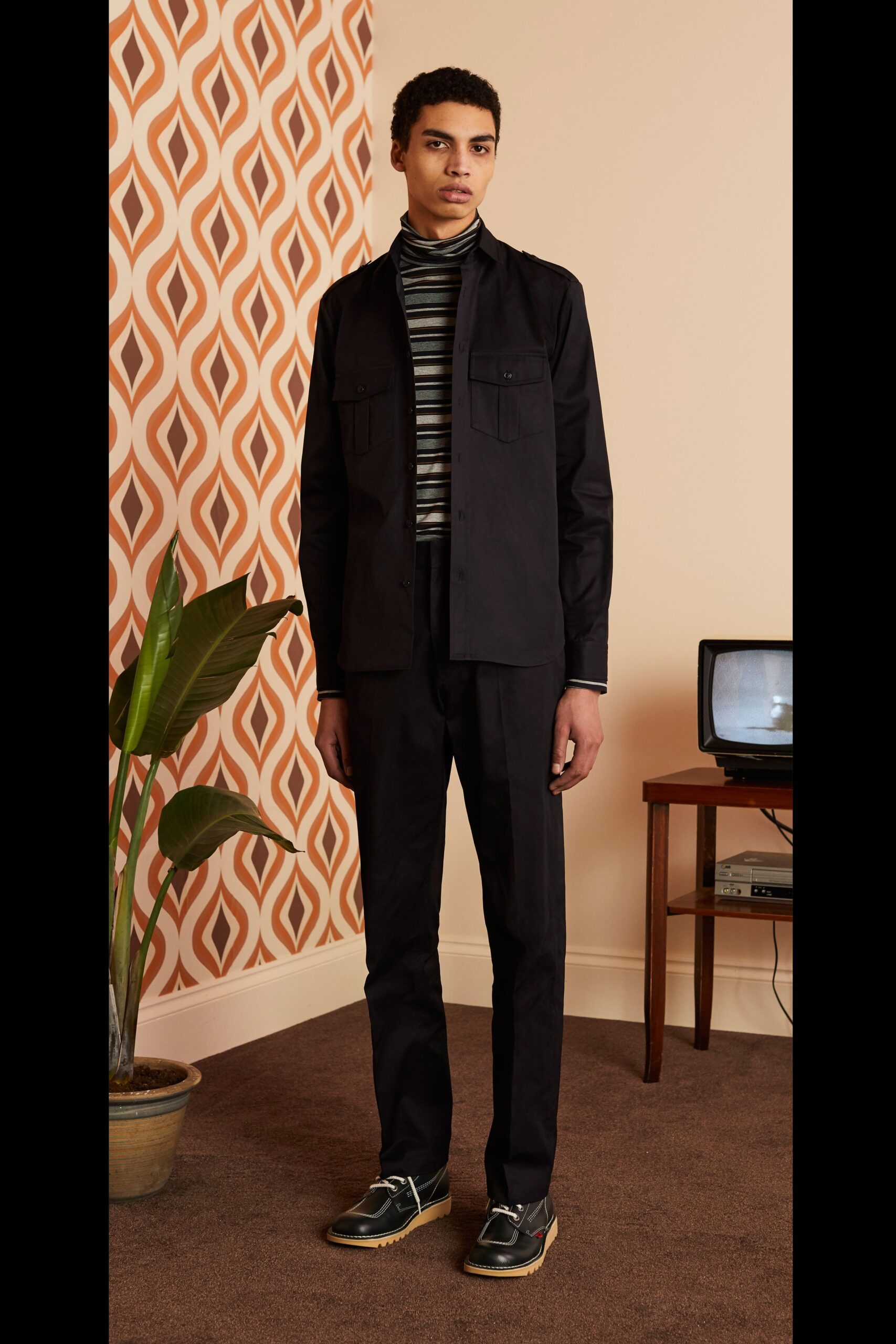 black fitted jacket with striped shirt