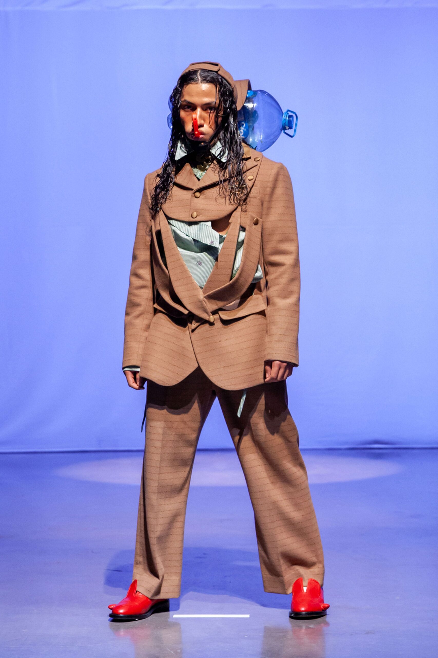 brown tailored suit with blue shirt