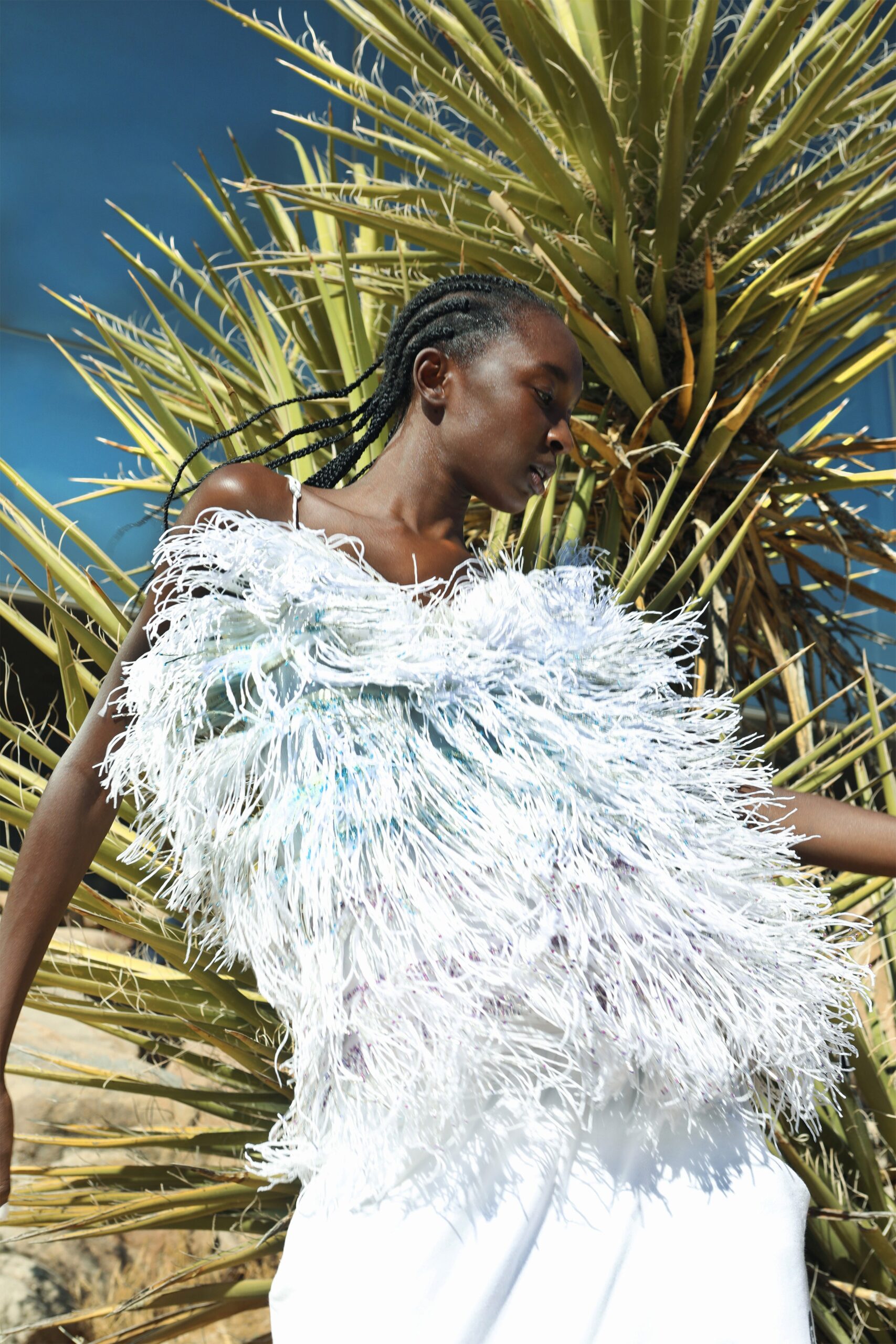 fringed silk top with white pants