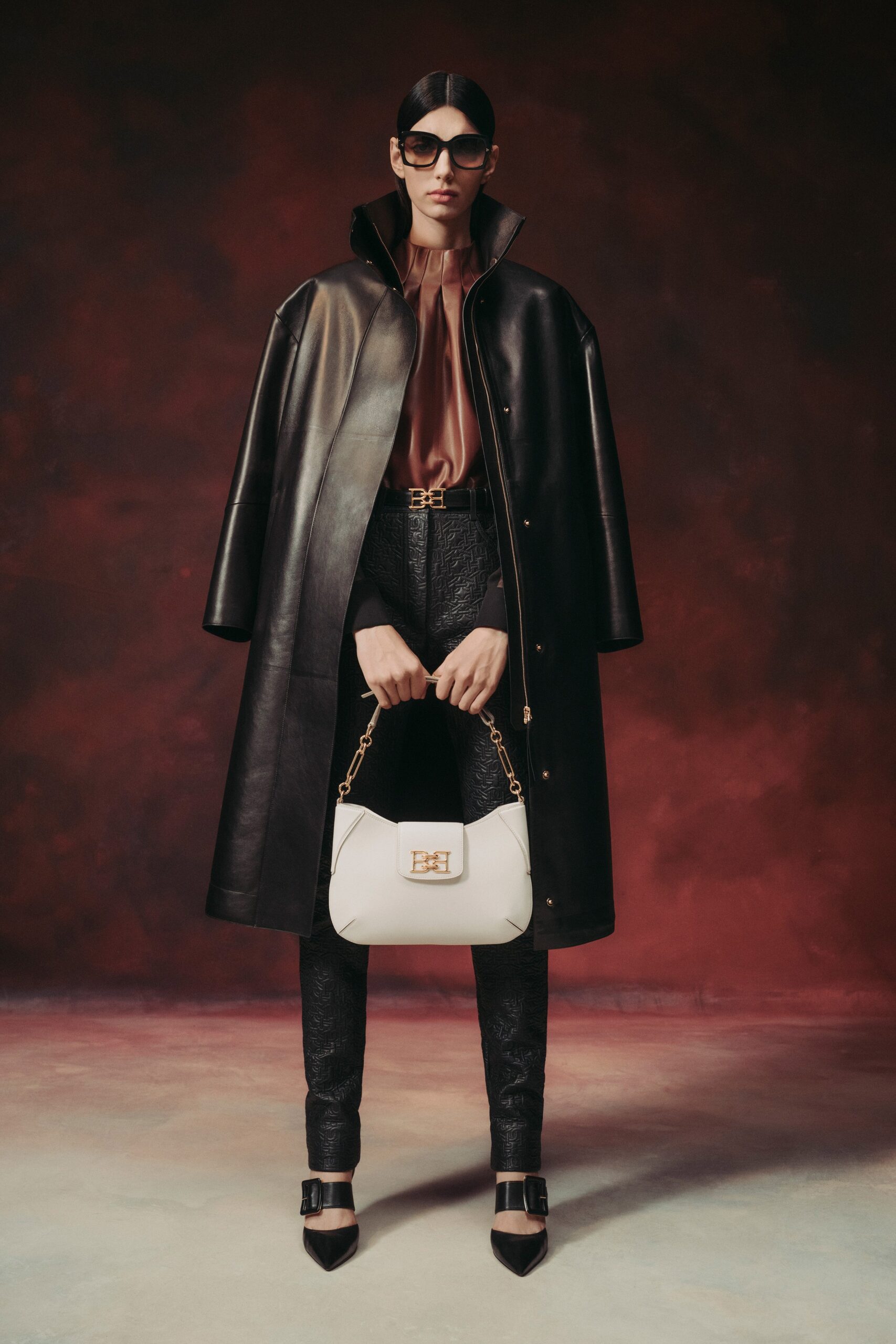 black leather coat with brown blouse