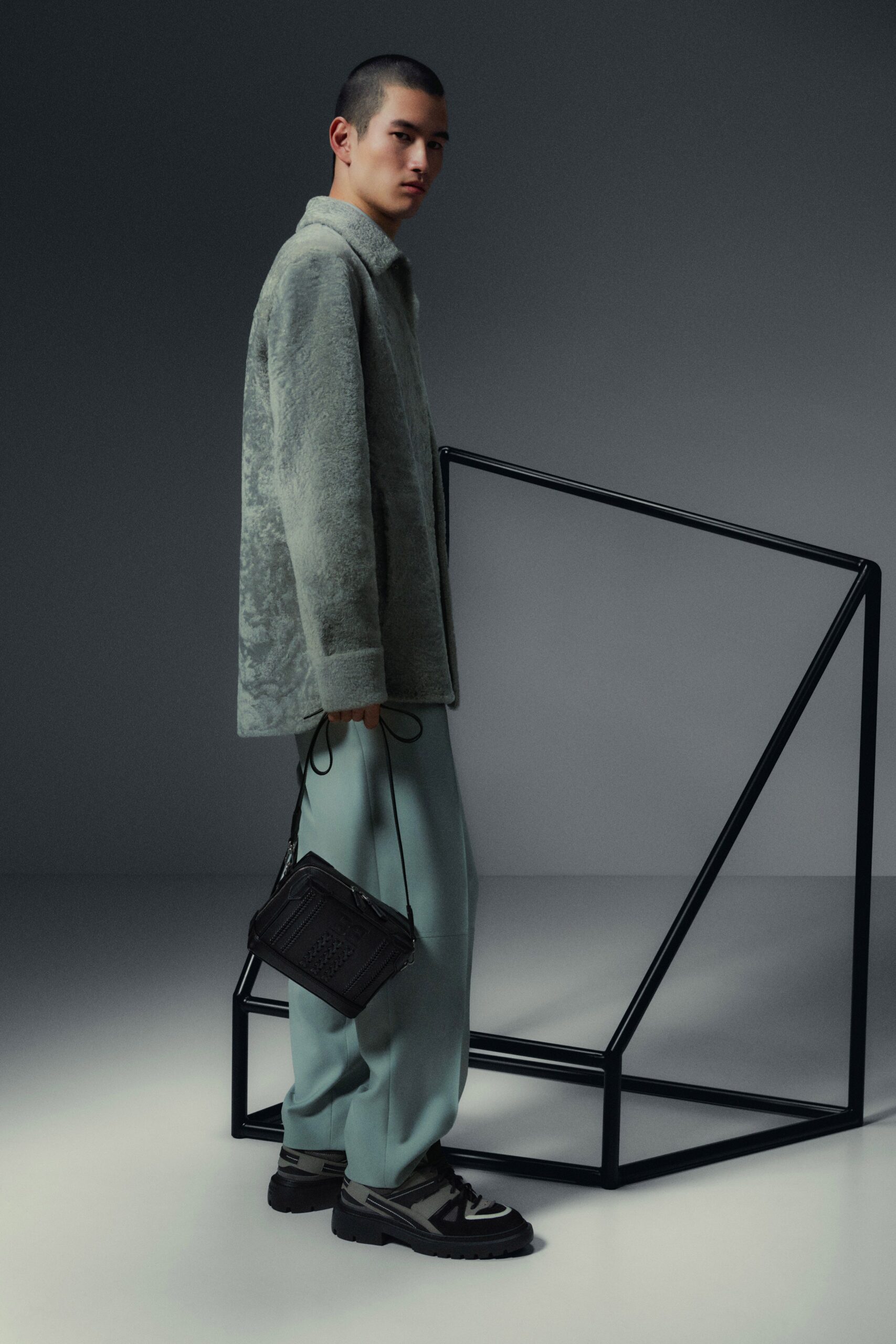 gray faux-fur jacket with blue pants