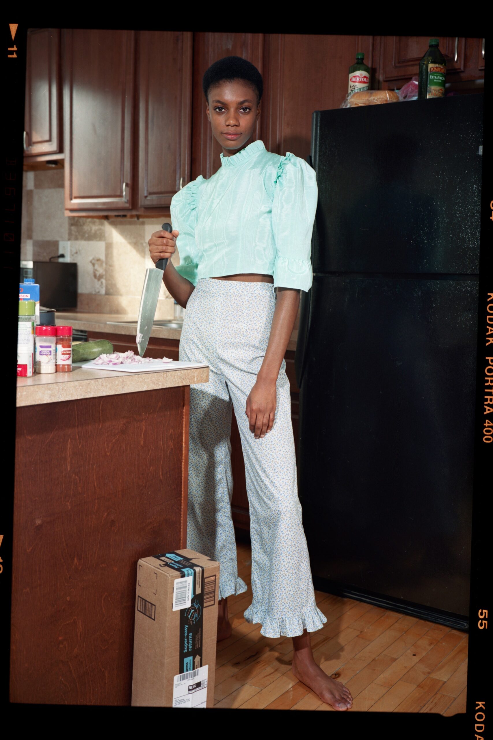 light blue ruffled top and flared pants