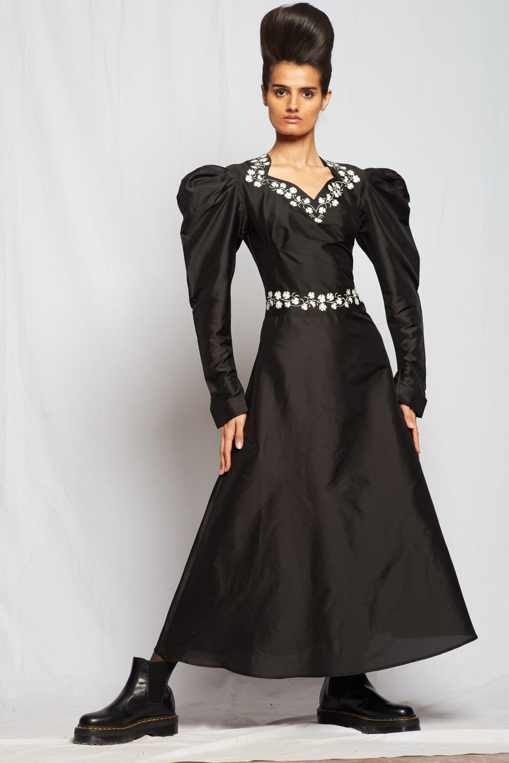 black silk long-sleeve dress with boots