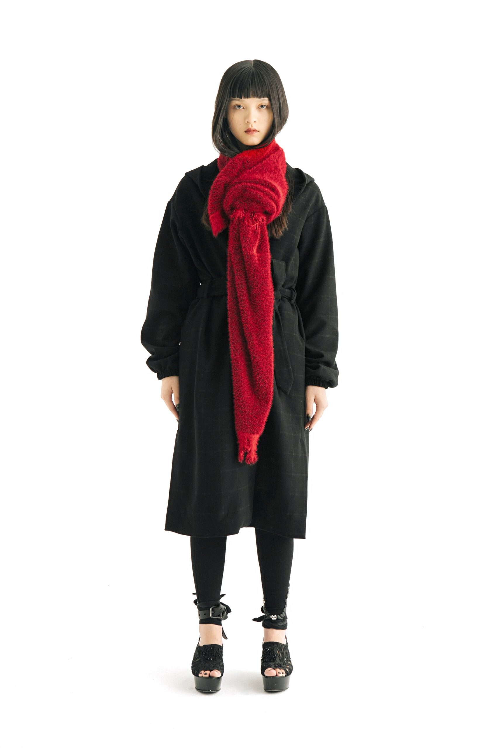 black coat with red scarf